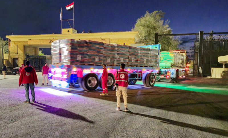 Aid trucks roll into Gaza as dispute over hostage bodies is paused