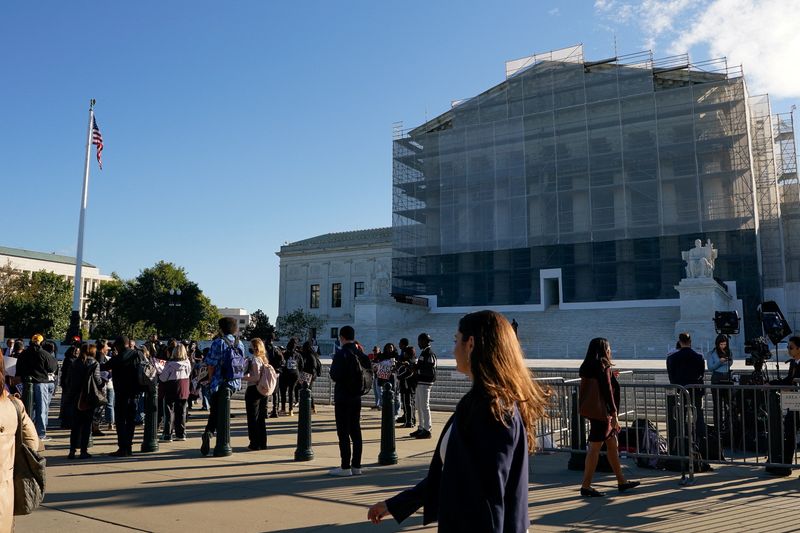 People protest outside the Supreme Court in Washington, Wednesday. Louisiana's solicitor general called race-based redistricting "fundamentally contrary."