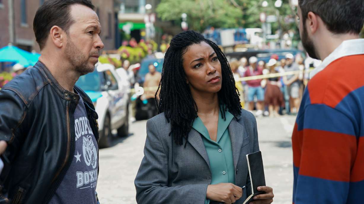 This image released by CBS shows Donnie Wahlberg, left, and Sonequa Martin-Green in a scene from "Boston Blue."