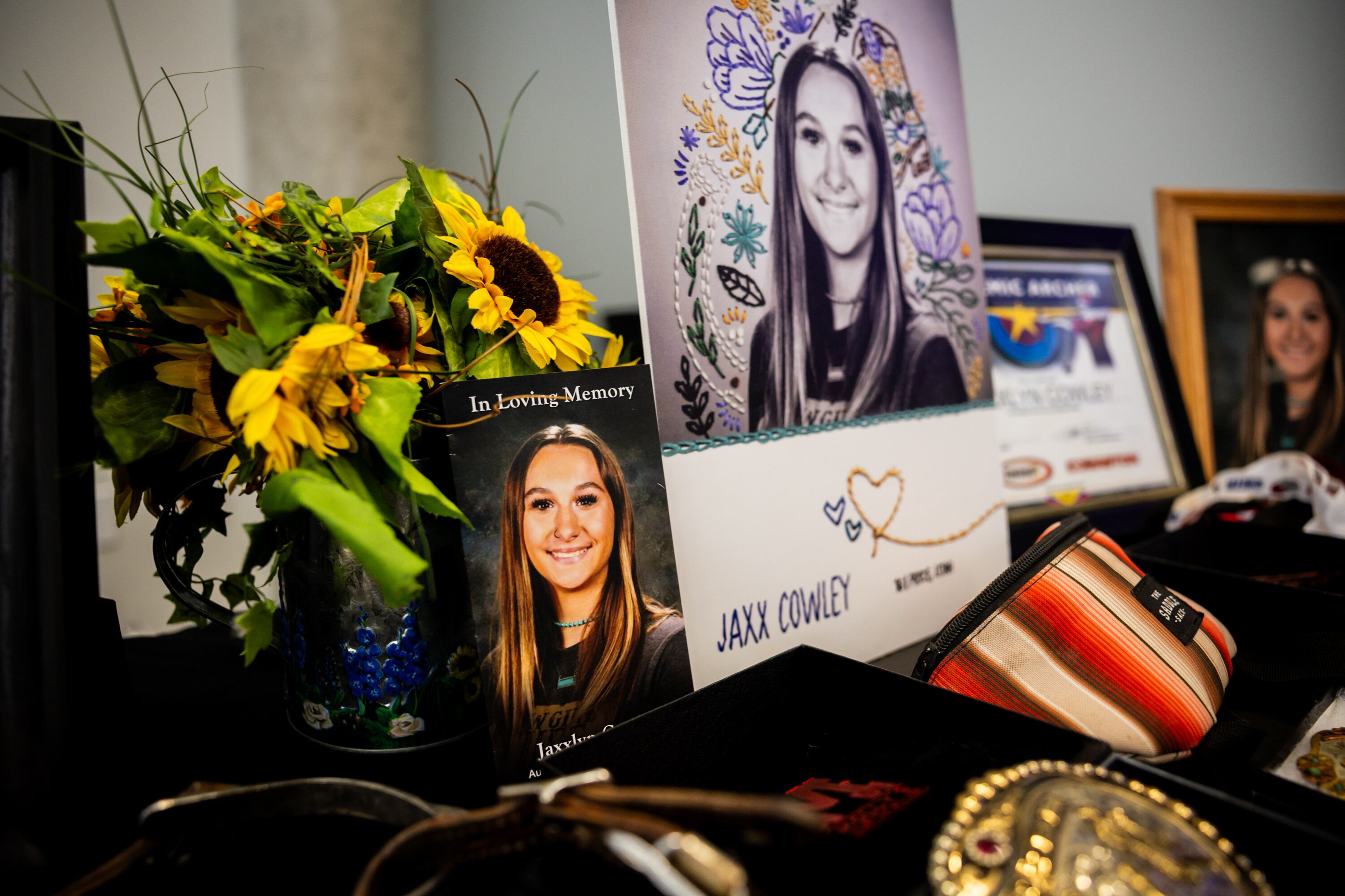 Photos and mementos of Jaxx Cowley, who died in a motor vehicle crash at age 16 in 2024, during the 17th annual Teen Memoriam press conference in Taylorsville on Wednesday. Cowley was orphaned and later taken in by foster parents.