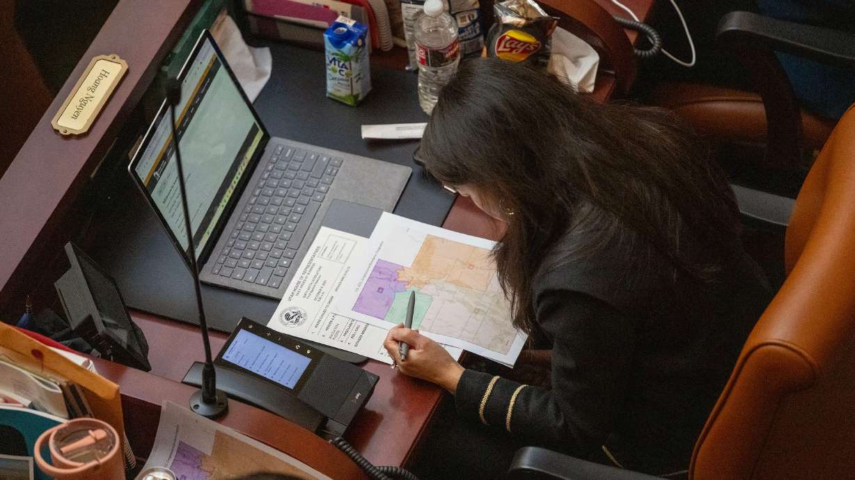 Rep. Hoang Nguyen, D-Salt Lake City, looks at a redistricting map in a special legislative session in Salt Lake City on Oct. 6. Potential Democratic candidates are pushing back against efforts to eliminate the recently approved new congressional map.