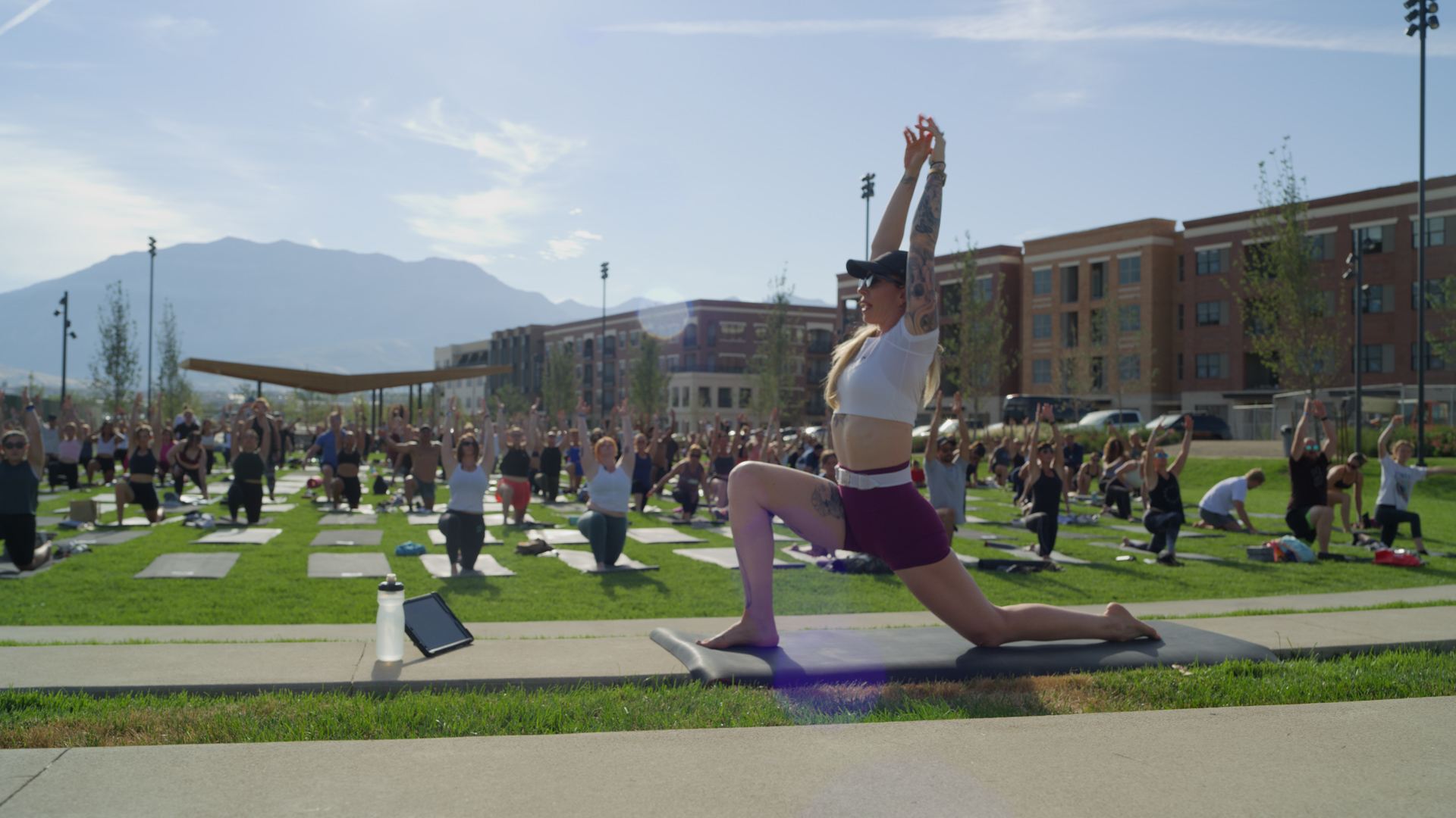 An outdoor yoga class on dubbed Utah City Sweat hosted by Kirra Michel in Vineyard on Aug. 23. A new partnership between the Utah City and Peloton now allows residents in multifamily units access to Peloton equipment.