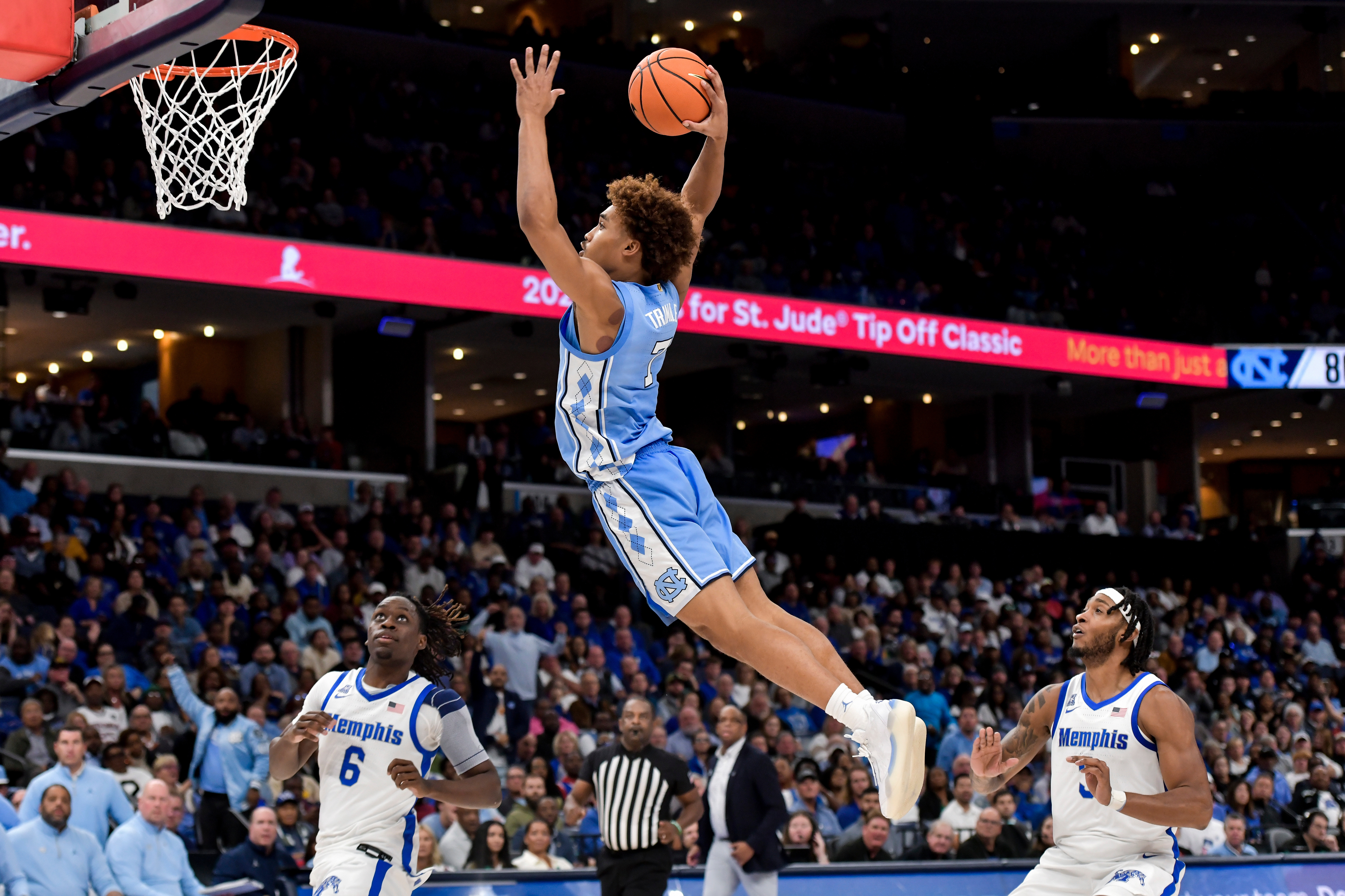 FILE - North Carolina guard Seth Trimble (7) dunks against Memphis during the Hoops for St. Jude Tip Off Classic NCAA college basketball exhibition game Tuesday, Oct. 15, 2024, in Memphis, Tenn.
