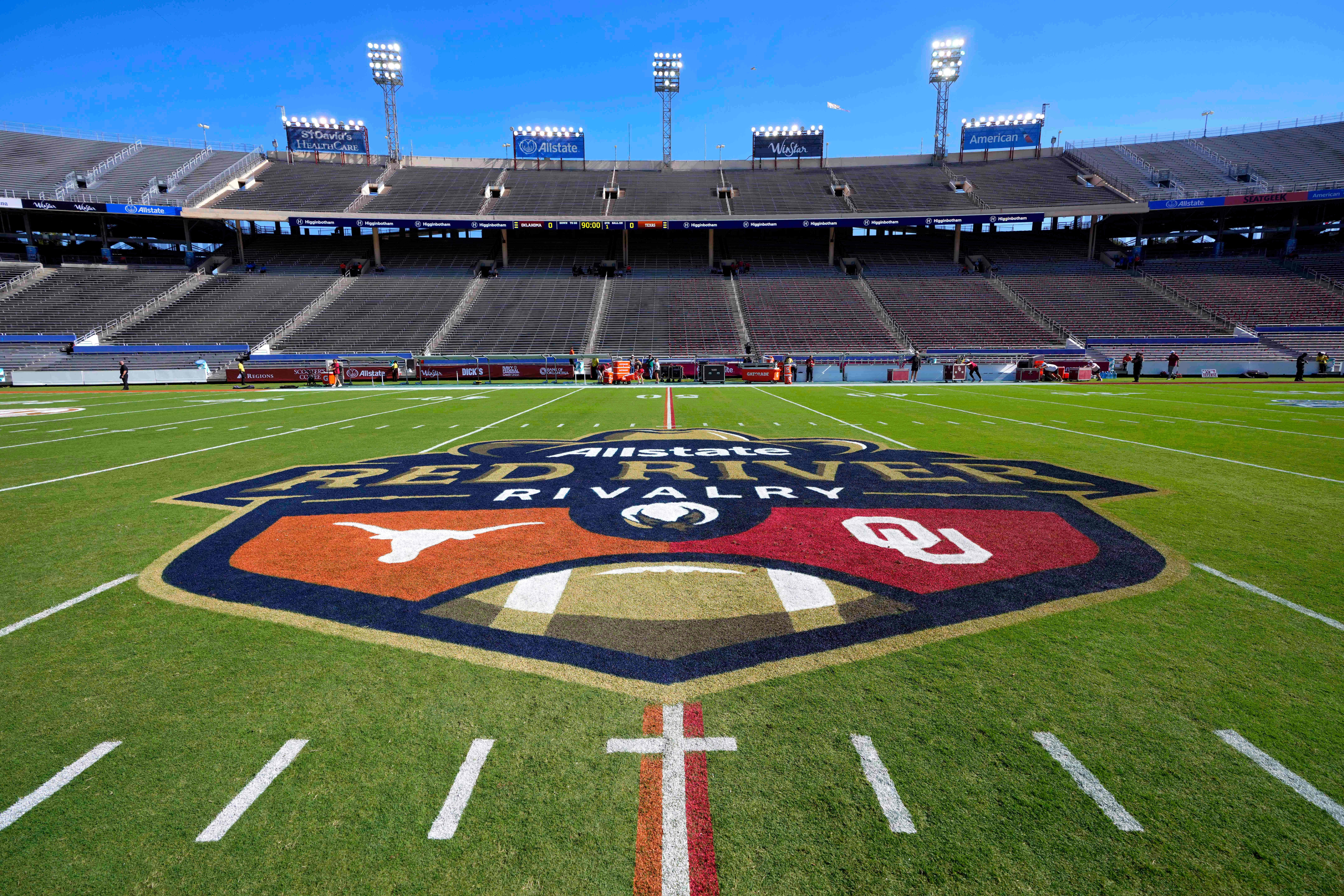 The logo of the Allstate Red River Rivalry is painted at midfield of the Cotton Bowl before an NCAA college football game between Texas and Oklahoma, Saturday, Oct. 11, 2025, in Dallas.