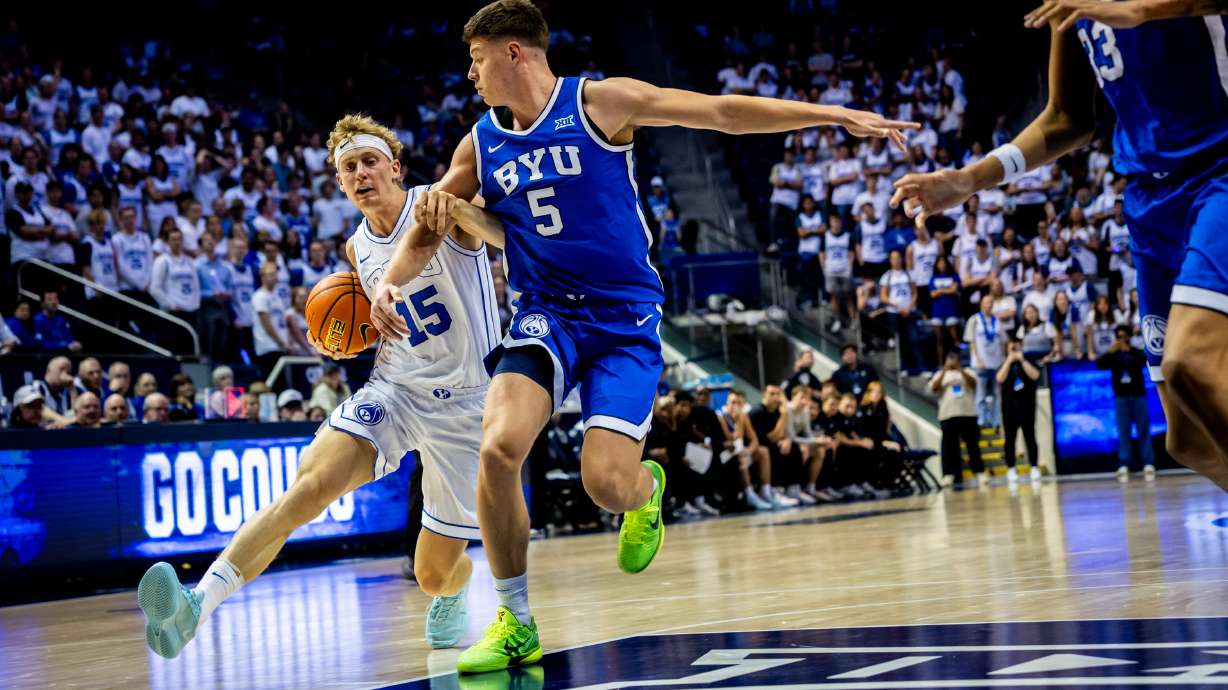 BYU basketball player Richie Saunders (15) runs toward the basket with Mihailo Bošković (5) on defense during their annual Blue-White Scrimmage at the Marriott Center in Provo on Thursday, Oct. 9, 2025.