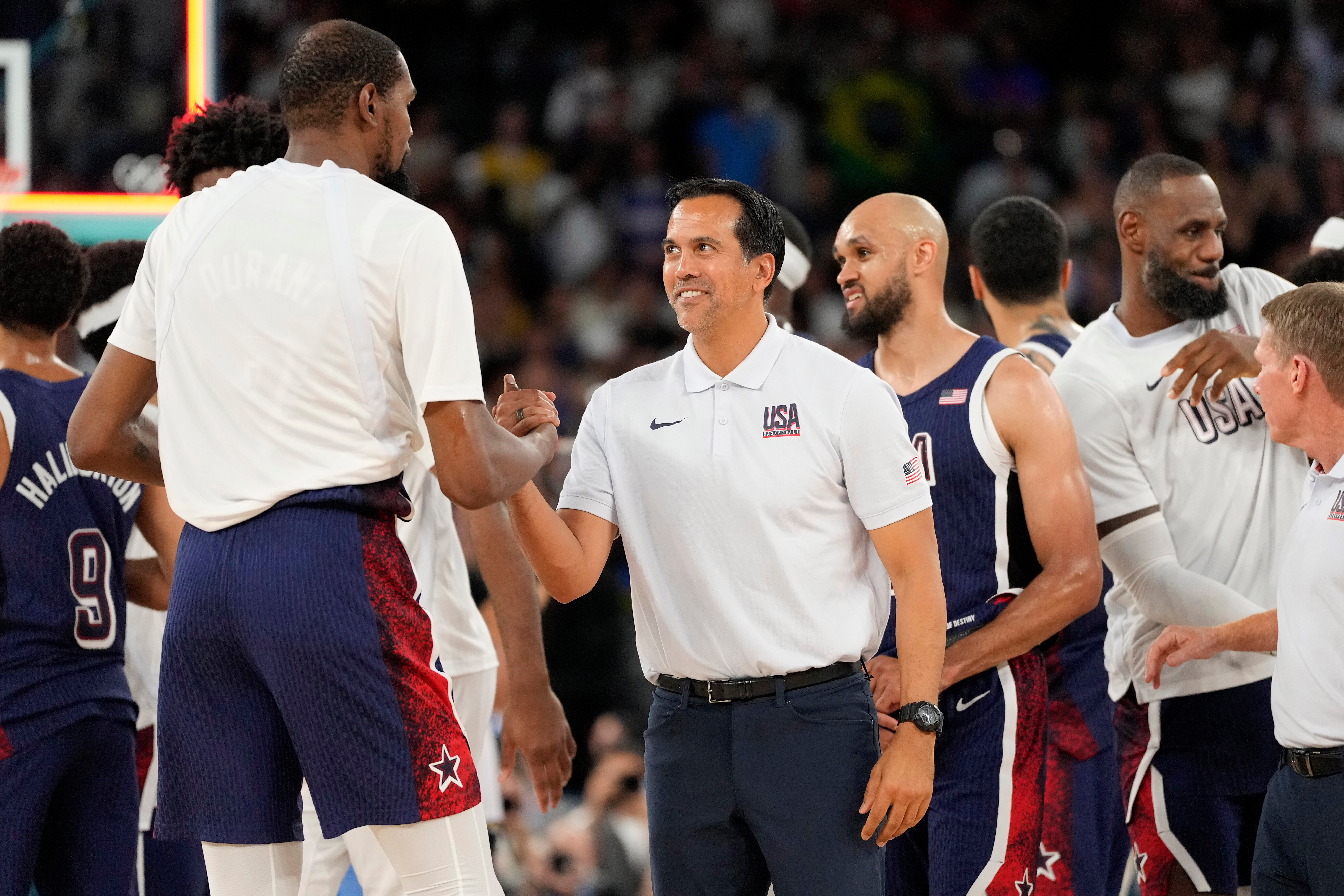 FILE - United States' Kevin Durant, left, and assistant coach Erik Spoelstra congratulate each other after the United States defeated Brazil in a men's basketball game at the 2024 Summer Olympics, Tuesday, Aug. 6, 2024, in Paris, France. 