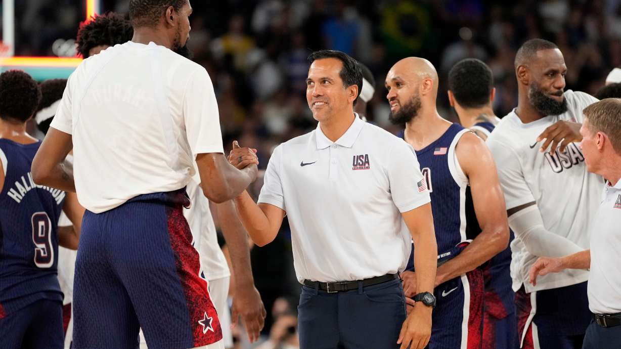 FILE - United States' Kevin Durant, left, and assistant coach Erik Spoelstra congratulate each other after the United States defeated Brazil in a men's basketball game at the 2024 Summer Olympics, Tuesday, Aug. 6, 2024, in Paris, France.