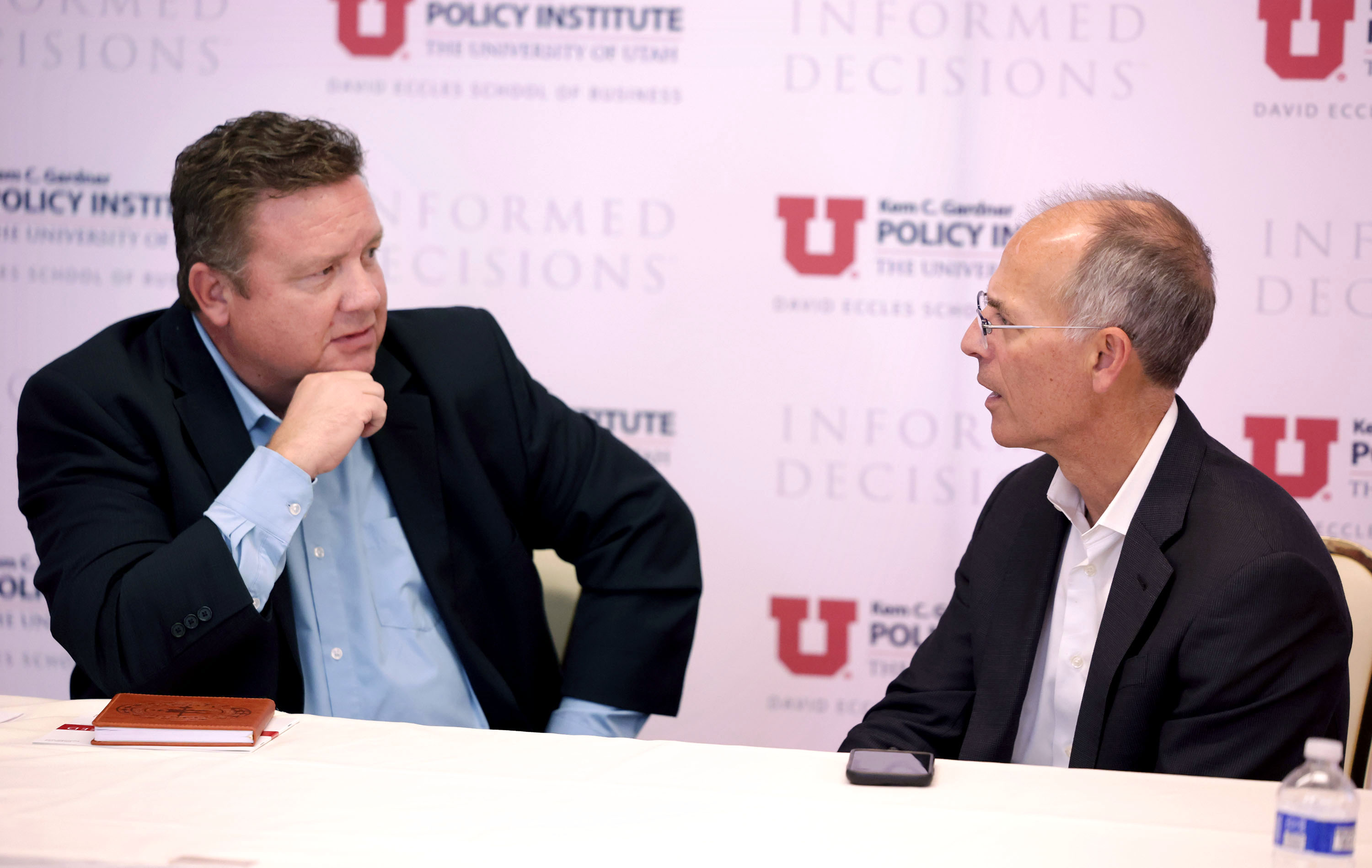 Gardner Institute chief economist Phil Dean, left, and Moody’s Analytics chief economist Mark Zandi  speak following a Kem C. Gardner Policy Institute media roundtable at the Thomas S. Monson Center in Salt Lake City on Thursday.