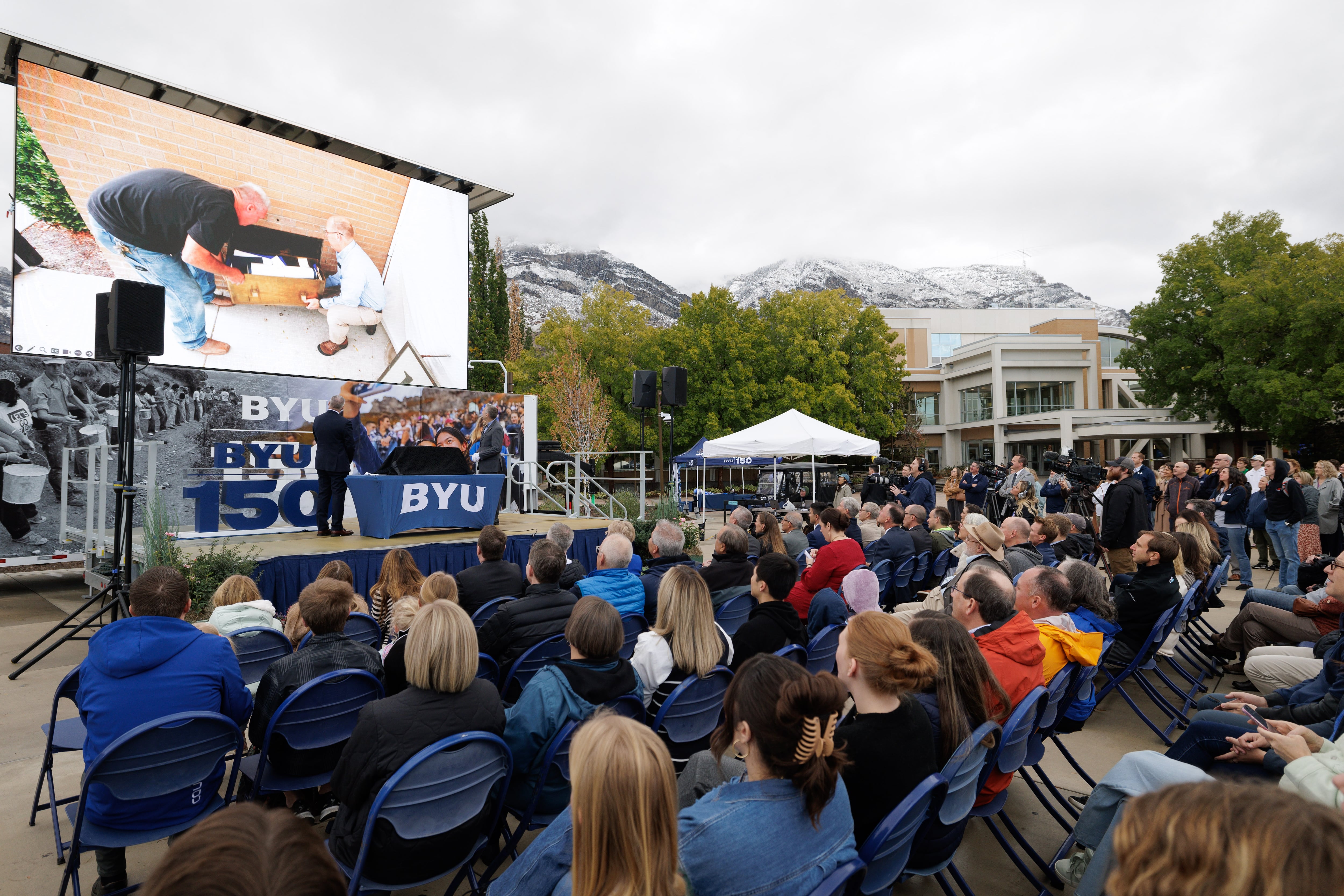 BYU President C. Shane Reese and university librarian Rick Anderson open the time capsule placed in the Harold B. Lee Library in Provo on Thursday. The celebration came on the day of the 150th anniversary of the school.
