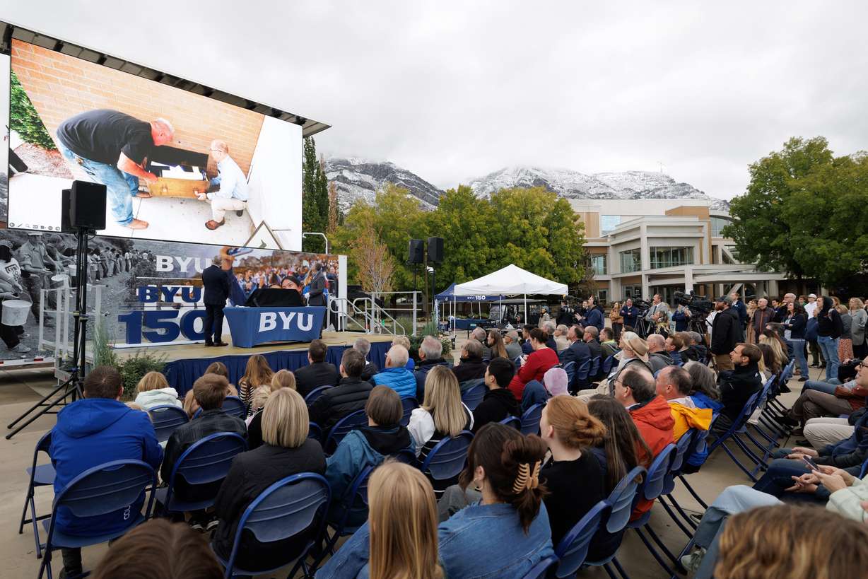 BYU President C. Shane Reese and university librarian Rick Anderson open the time capsule placed in the Harold B. Lee Library in Provo on Thursday. The celebration came on the day of the 150th anniversary of the school.