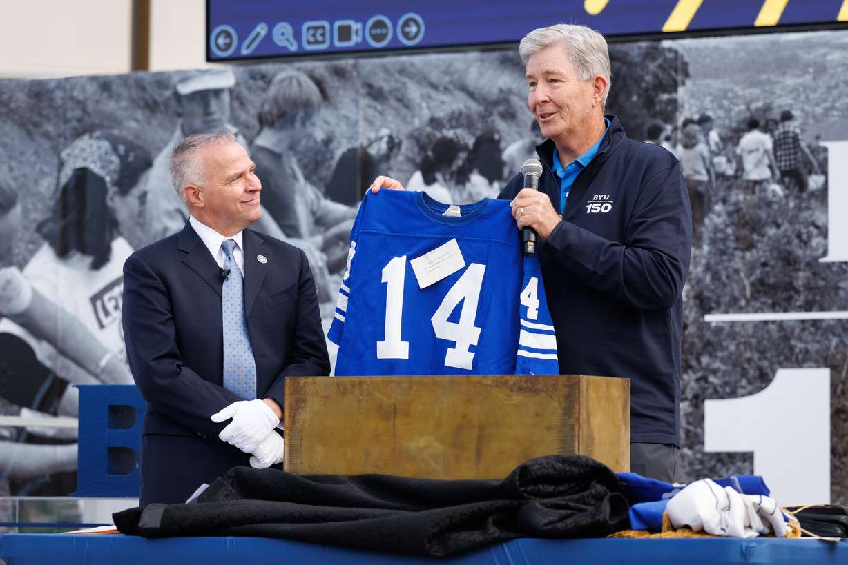 BYU President C. Shane Reese is joined by Elder S. Gifford Nielsen, General Authority Seventy of The Church of Jesus Christ of Latter-day Saints, Thursday in Provo. Nielsen's game-worn football jersey was part of a time capsule unveiled by the school.