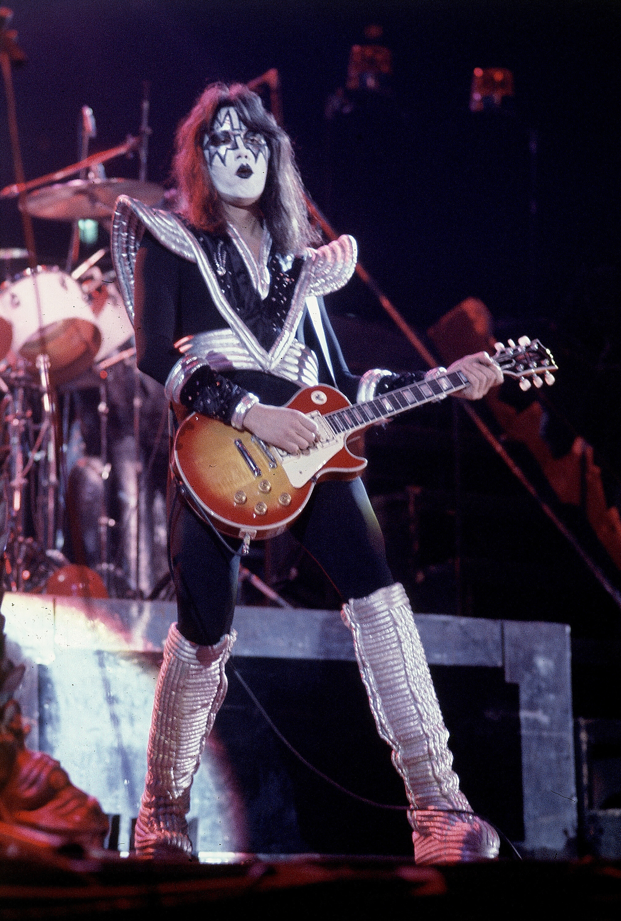 Ace Frehley, lead guitarist for the hard-rock glam band KISS, performs with a Les Paul guitar during a concert at the Civic Center in Hartford, Conn., Feb. 16, 1977. Frehley, the original lead guitarist, died Thursday at the age of 74.