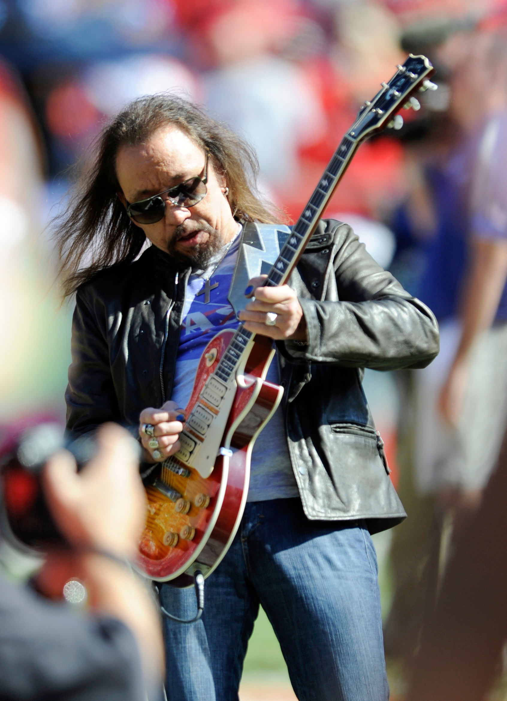 Former Kiss lead guitarist Ace Frehley plays the national anthem before an NFL football game in Kansas City, Mo., Oct. 4, 2009. Frehley died Thursday at the age of 74.