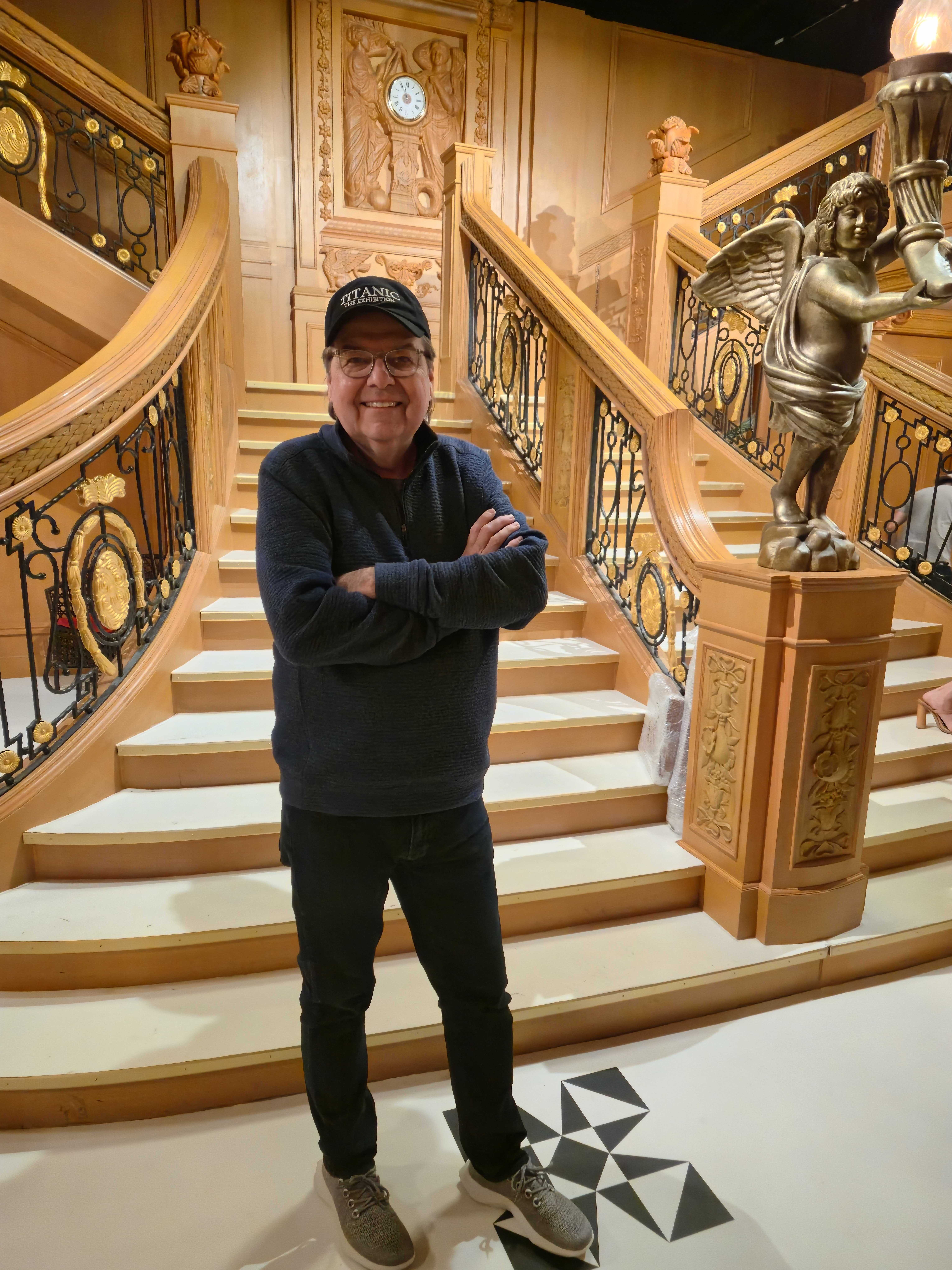 Mark Lach, creative producer for The Titanic Exhibition, poses in front of a replica of the ill-fated ocean liner's grand staircase. The traveling exhibit featuring all things Titanic opens Friday at The Shops at South Town in Sandy.