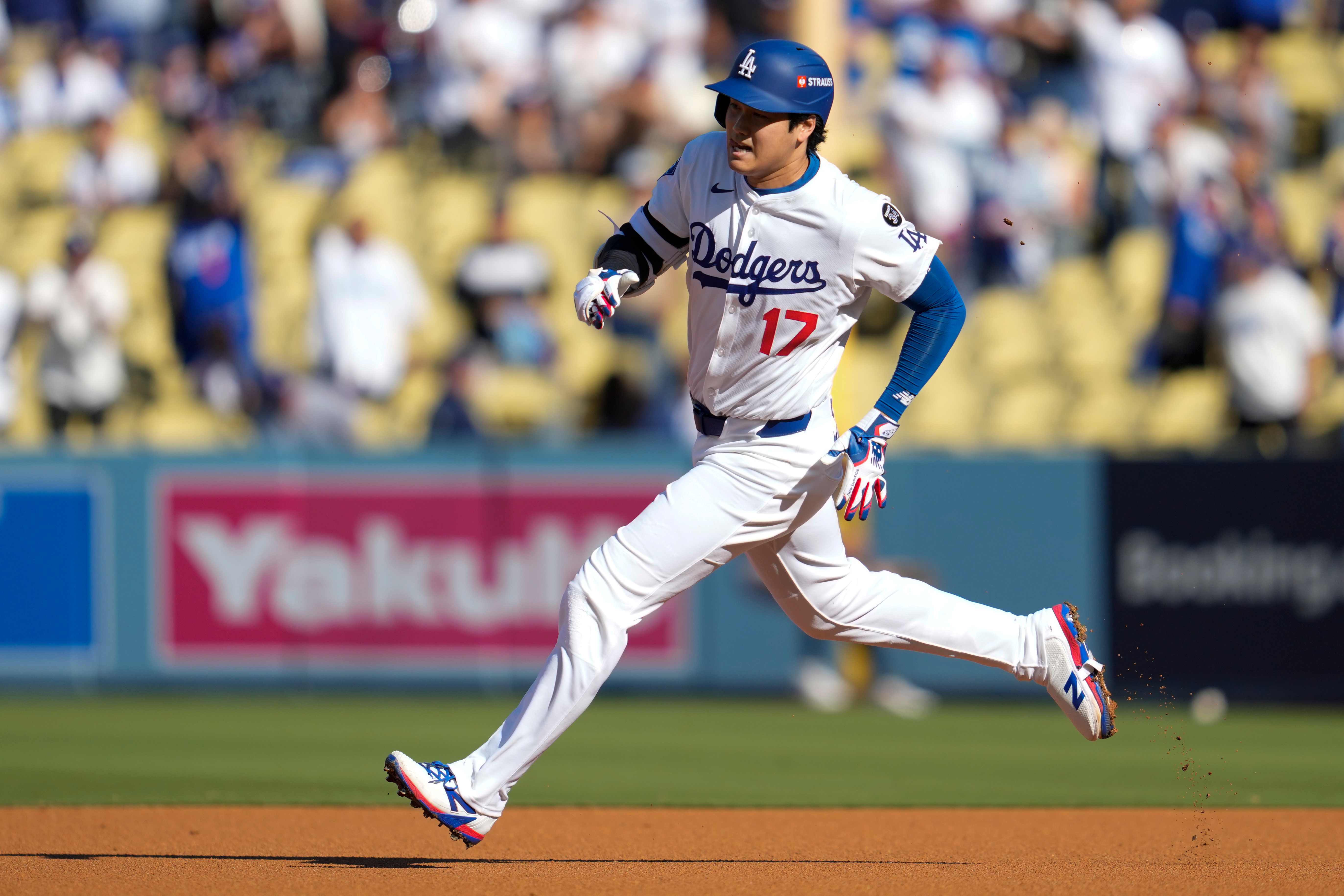 Los Angeles Dodgers' Shohei Ohtani rounds the bases after a triple against the Milwaukee Brewers during the first inning in Game 3 of baseball's National League Championship Series, Thursday, Oct. 16, 2025, in Los Angeles.