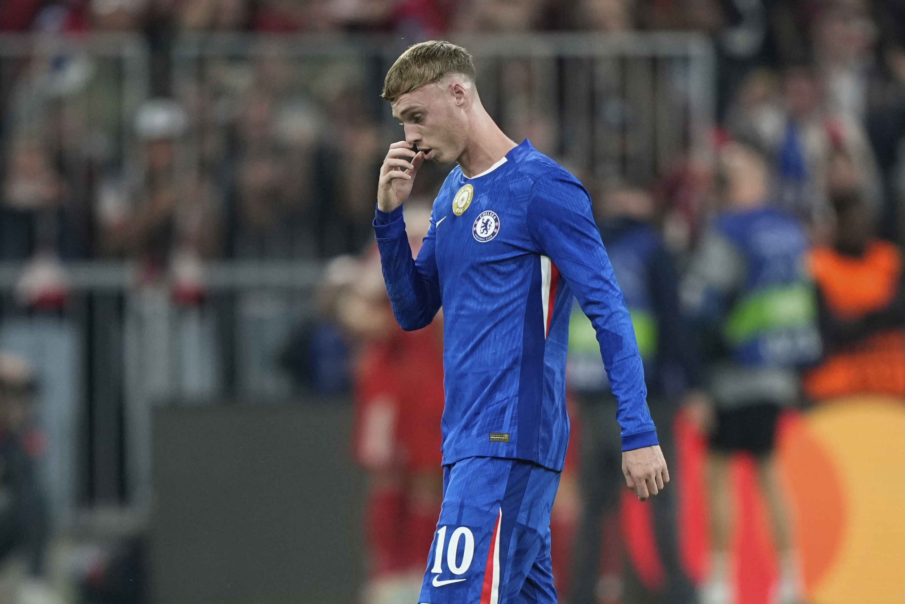 Chelsea's Cole Palmer gestures after Bayern's Harry Kane scored his side's third goal during the Champions League opening phase soccer match between FC Bayern Munich and Chelsea at the Allianz Arena in Munich, Germany, Wednesday, Sept. 17, 2025.