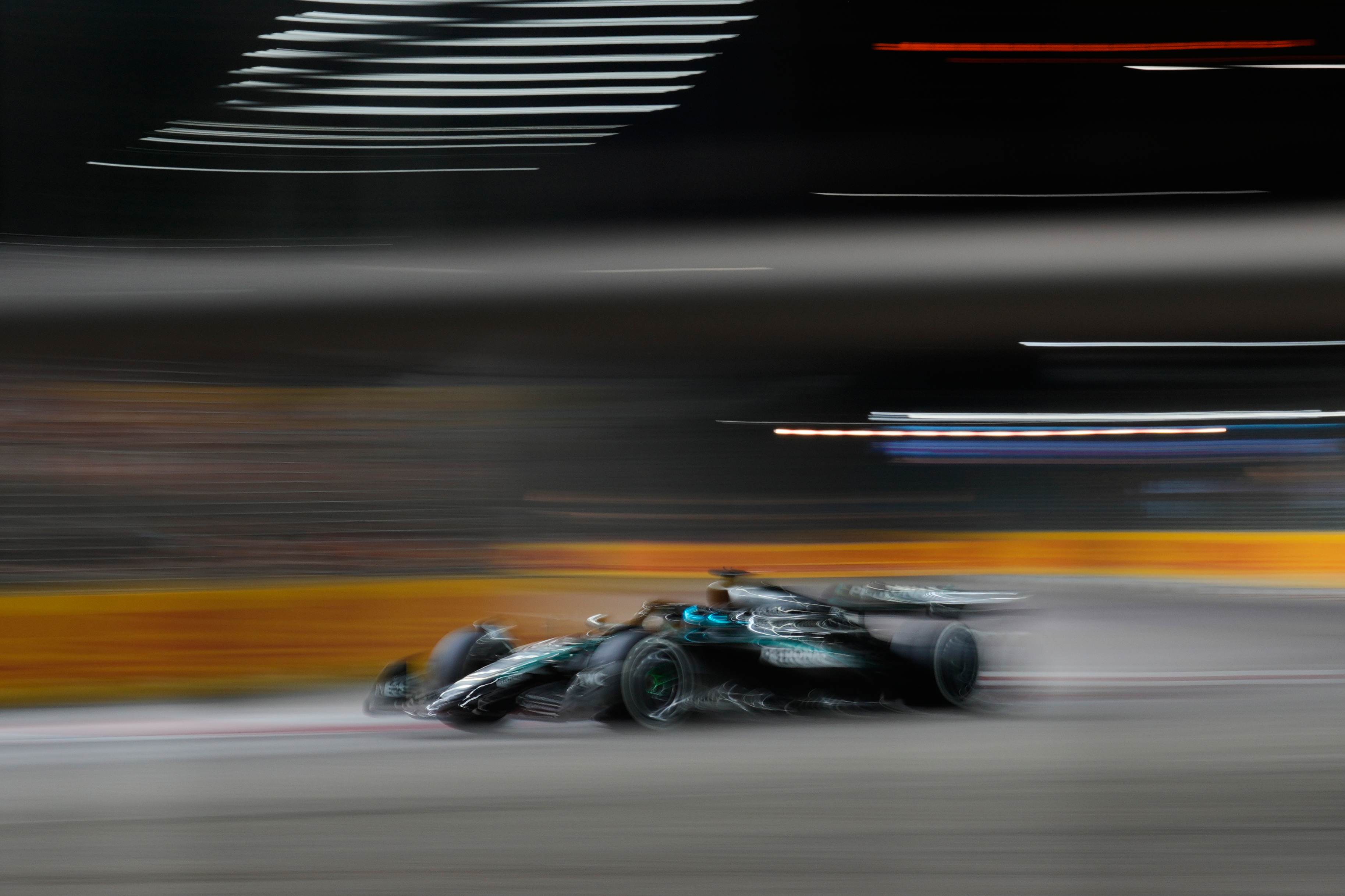 Mercedes driver George Russell of Britain powers his car during the Singapore Formula One Grand Prix at the Marina Bay Street Circuit in Singapore, Sunday, Oct. 5, 2025. 