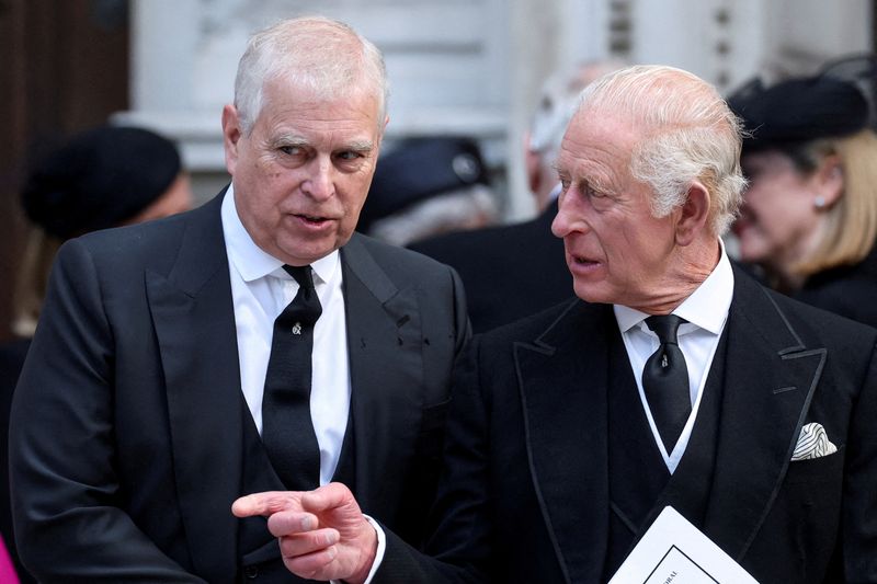 Britain's Prince Andrew speaks with King Charles at Westminster Cathedral in London, Sept. 16. Andrew said Friday the accusations against him distracted from the king's work, and the royal family as a whole.