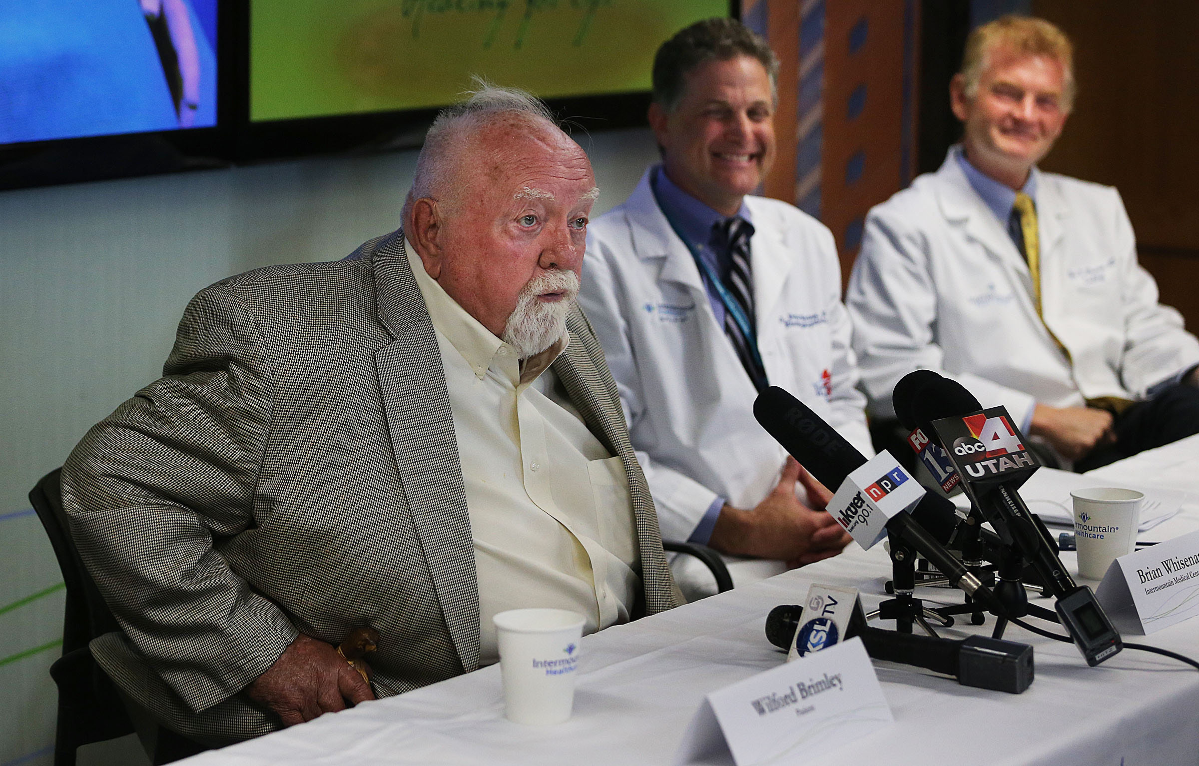 Wilford Brimley talks during a press conference at Intermountain Medical Center in Murray on May 16, 2016, about receiving a WATCHMAN left atrial appendage closure device as Dr. Pete Weiss and Dr. Brian Whisenant look on.