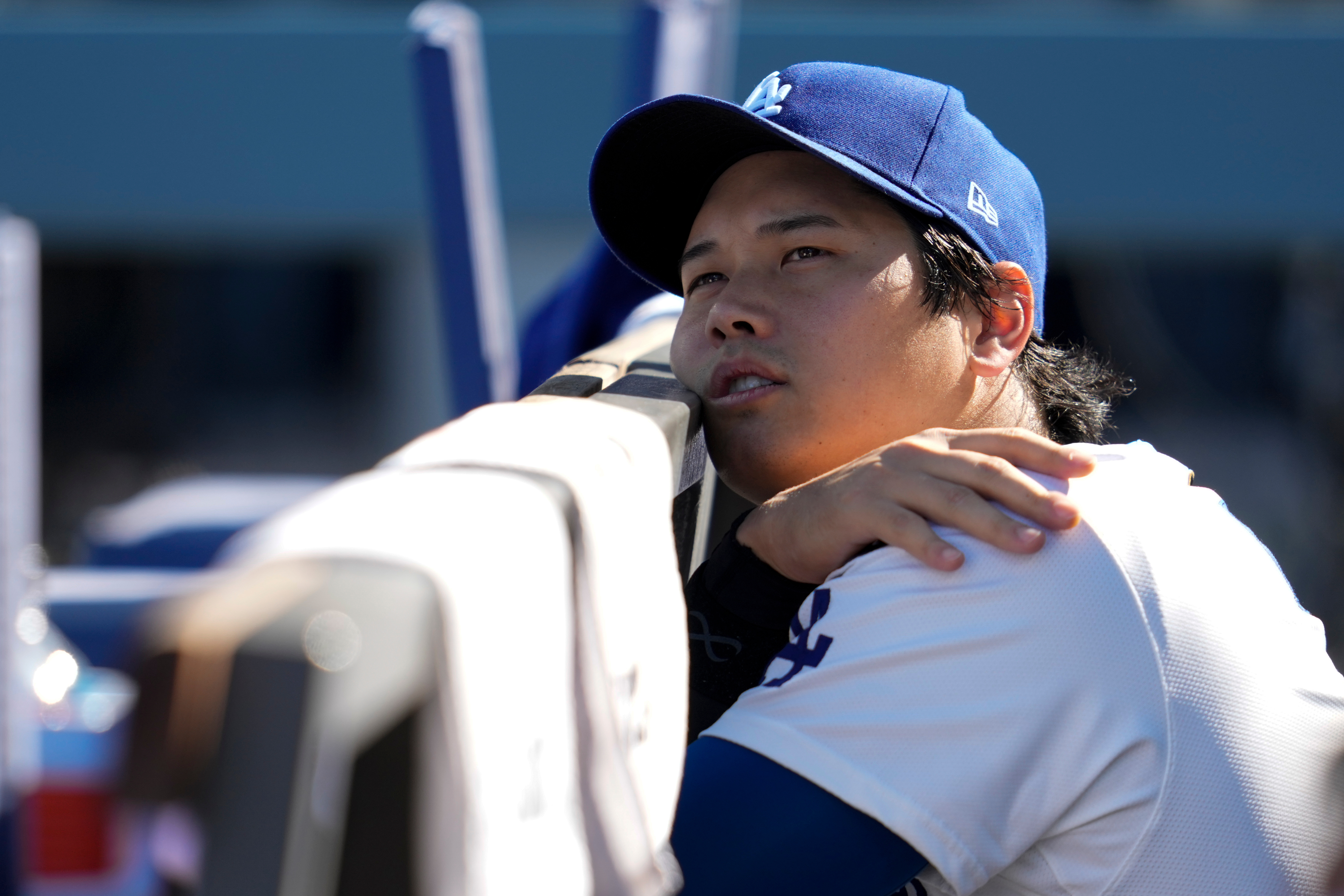 Los Angeles Dodgers' Shohei Ohtani wait for the start of Game 3 of baseball's National League Championship Series between the Milwaukee Brewers and the Los Angeles Dodgers, Thursday, Oct. 16, 2025, in Los Angeles. 