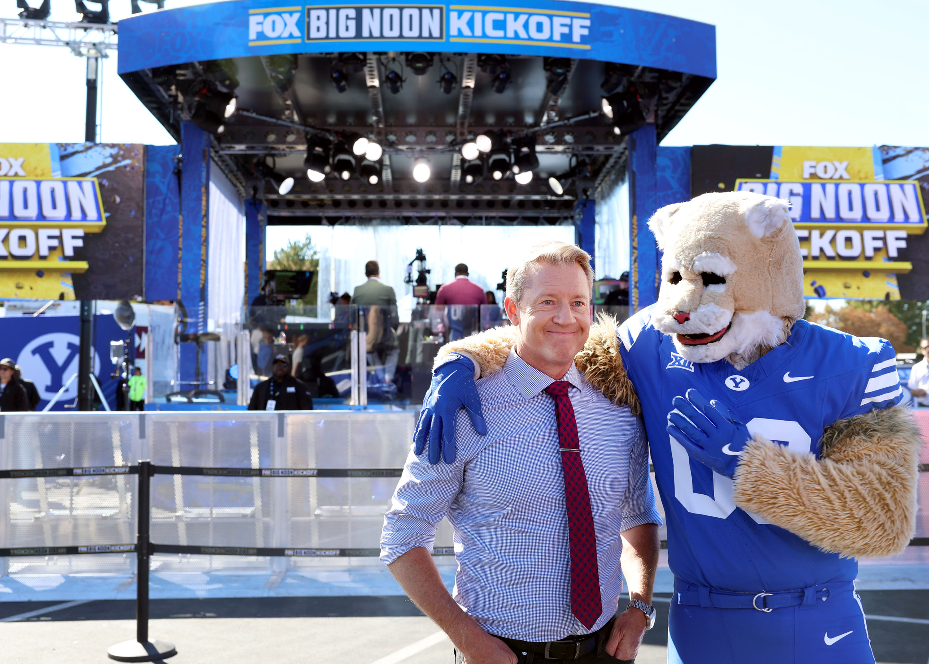 Rob Stone of “Big Noon Kickoff” hangs out with Cosmo during the setup for tomorrow’s live broadcast from BYU in Provo on Friday, Oct. 17, 2025.