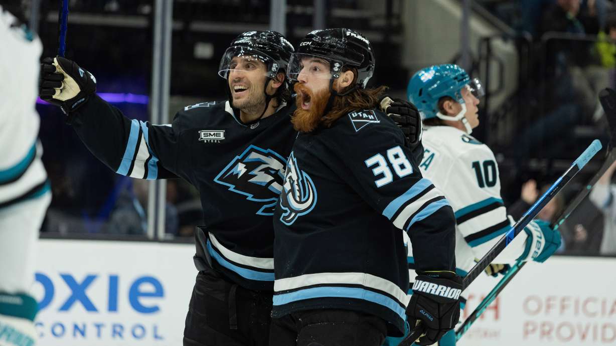Utah Mammoth center Liam O'Brien (38) celebrates the goal with left wing Brandon Tanev (13) against San Jose Sharks during the second period of an NHL hockey game Friday, Oct. 17, 2025, in Salt Lake City.