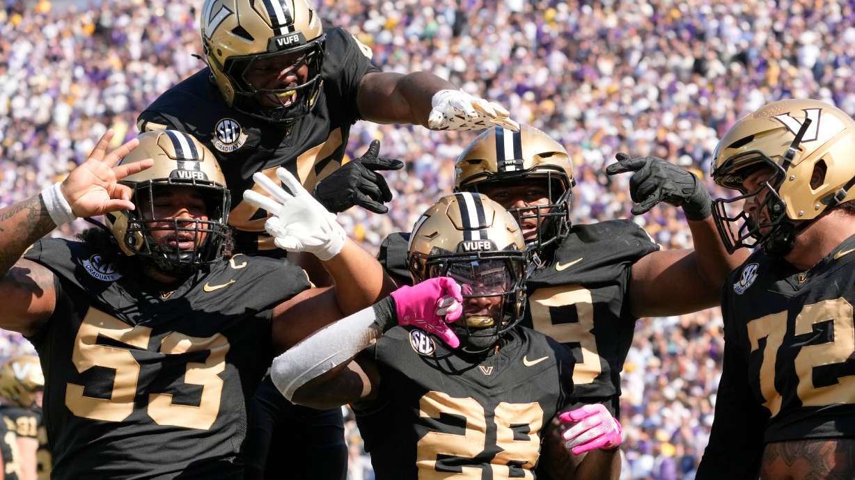Vanderbilt running back Sedrick Alexander (28) celebrates his touchdown with teammates during the first half of an NCAA college football game against LSU, Saturday, Oct. 18, 2025, in Nashville, Tenn.