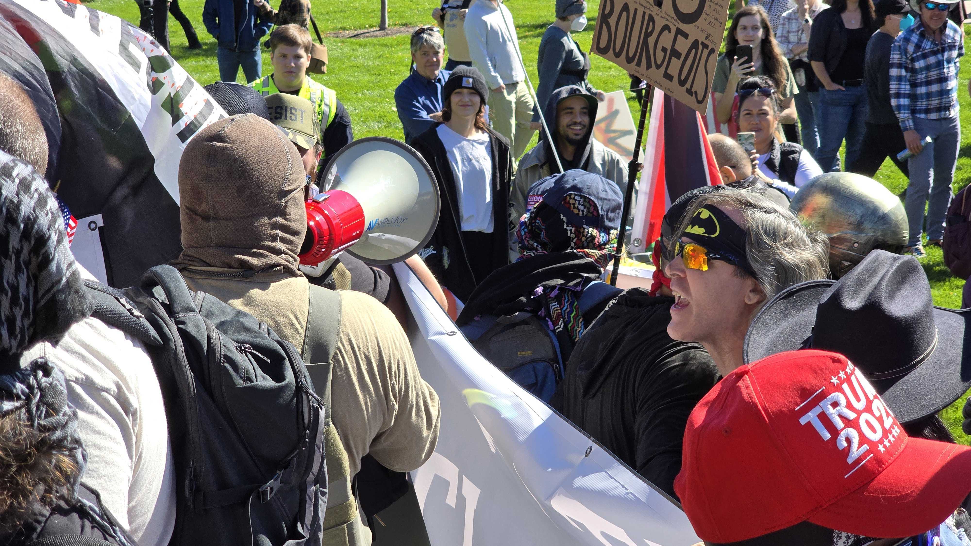 A protester and counter-demonstrator yell at each other at a No Kings rally at the state Capitol in Salt Lake City on Saturday.