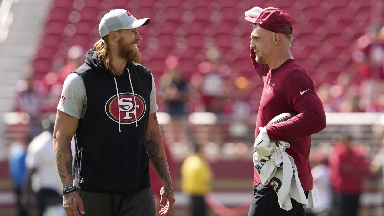 San Francisco 49ers tight end George Kittle, left, and Arizona Cardinals tight end Trey McBride chat prior to an NFL football game Sunday, Sept. 21, 2025, in Santa Clara.