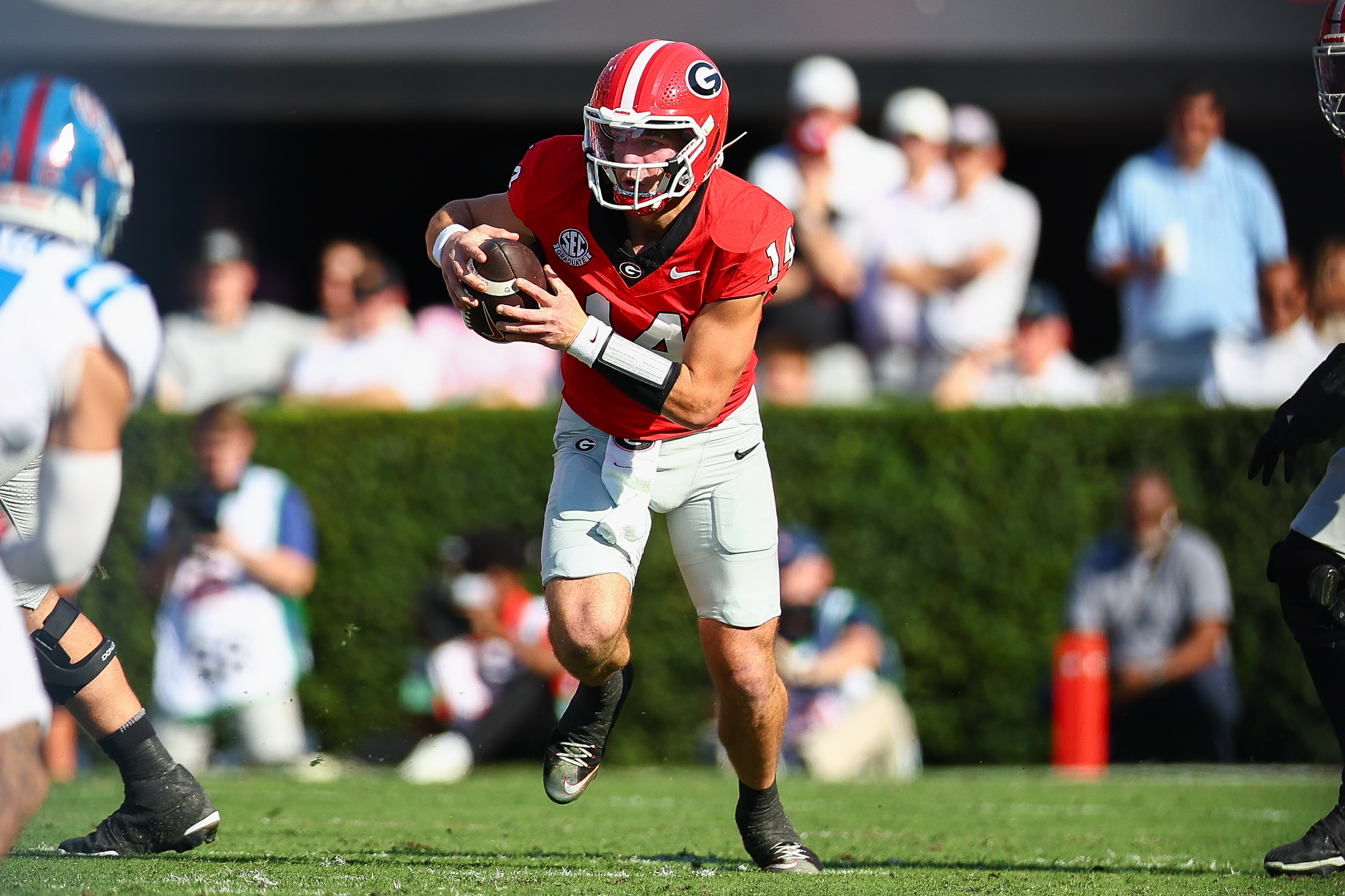 Georgia quarterback Gunner Stockton (14) runs with the ball during the first half of an NCAA college football game against Mississippi, Saturday, Oct. 18, 2025, in Athens, Ga. 
