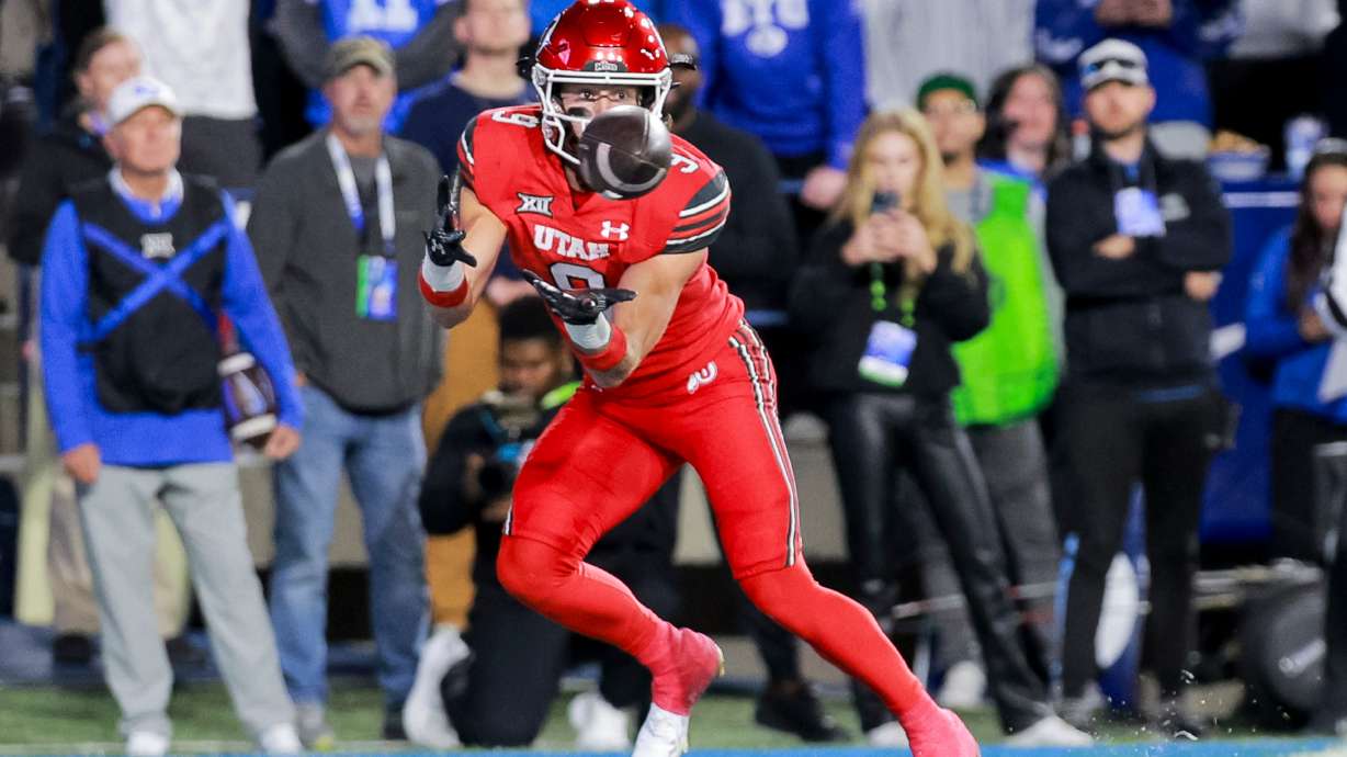 Utah wide receiver Ryan Davis (9) catches the ball for a touchdown during the second quarter of the game against BYU at LaVell Edwards Stadium in Provo on Saturday, Oct. 18, 2025.