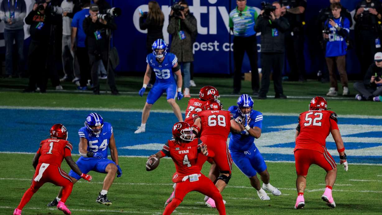 Utah quarterback Devon Dampier (4) passes the ball during the fourth quarter of the game against BYU at LaVell Edwards Stadium in Provo on Saturday, Oct. 18, 2025.