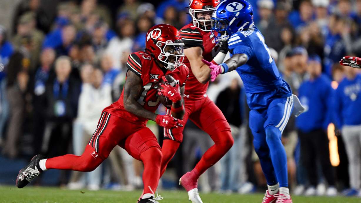 Utah running back Daniel Bray (13) sprints into the open field and around the outside on his way in for a touchdown as BYU and Utah play at LaVell Edwards Stadium in Provo on Saturday, Oct. 18, 2025.