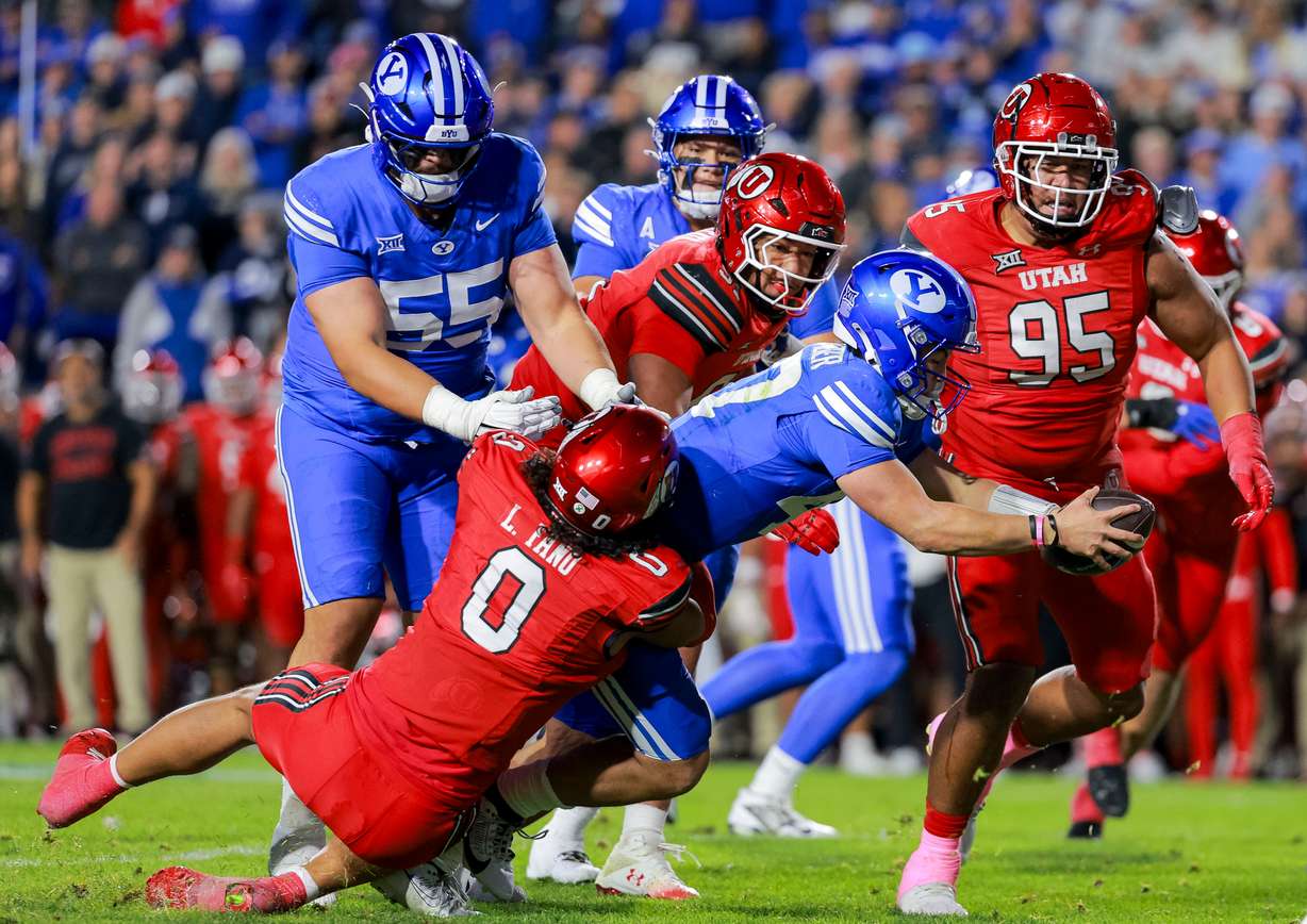 BYU quarterback Bear Bachmeier (47) dives for a first down during the second quarter of the game against Utah at LaVell Edwards Stadium in Provo on Saturday, Oct. 18, 2025.