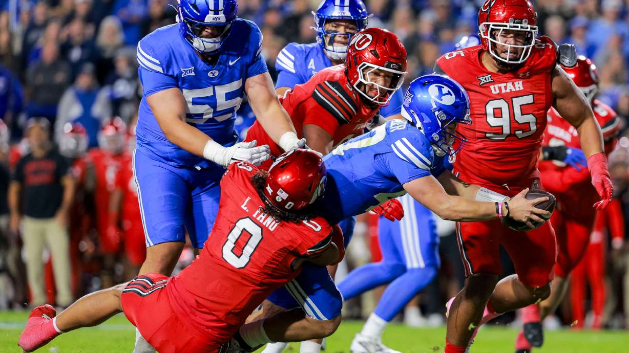BYU quarterback Bear Bachmeier (47) dives for a first down during the second quarter of the game against Utah at LaVell Edwards Stadium in Provo on Saturday, Oct. 18, 2025.