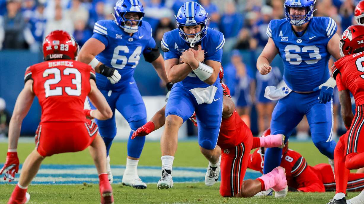 BYU quarterback Bear Bachmeier (47) runs with the ball during the first quarter of the game against Utah at LaVell Edwards Stadium in Provo on Saturday, Oct. 18, 2025.