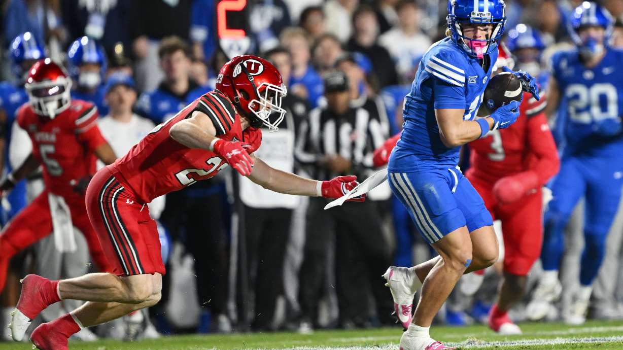 Utah safety Jackson Bennee (23) defends BYU wide receiver Parker Kingston (11) as he makes a catch over the middle as BYU and Utah play at LaVell Edwards Stadium in Provo on Saturday, Oct. 18, 2025.