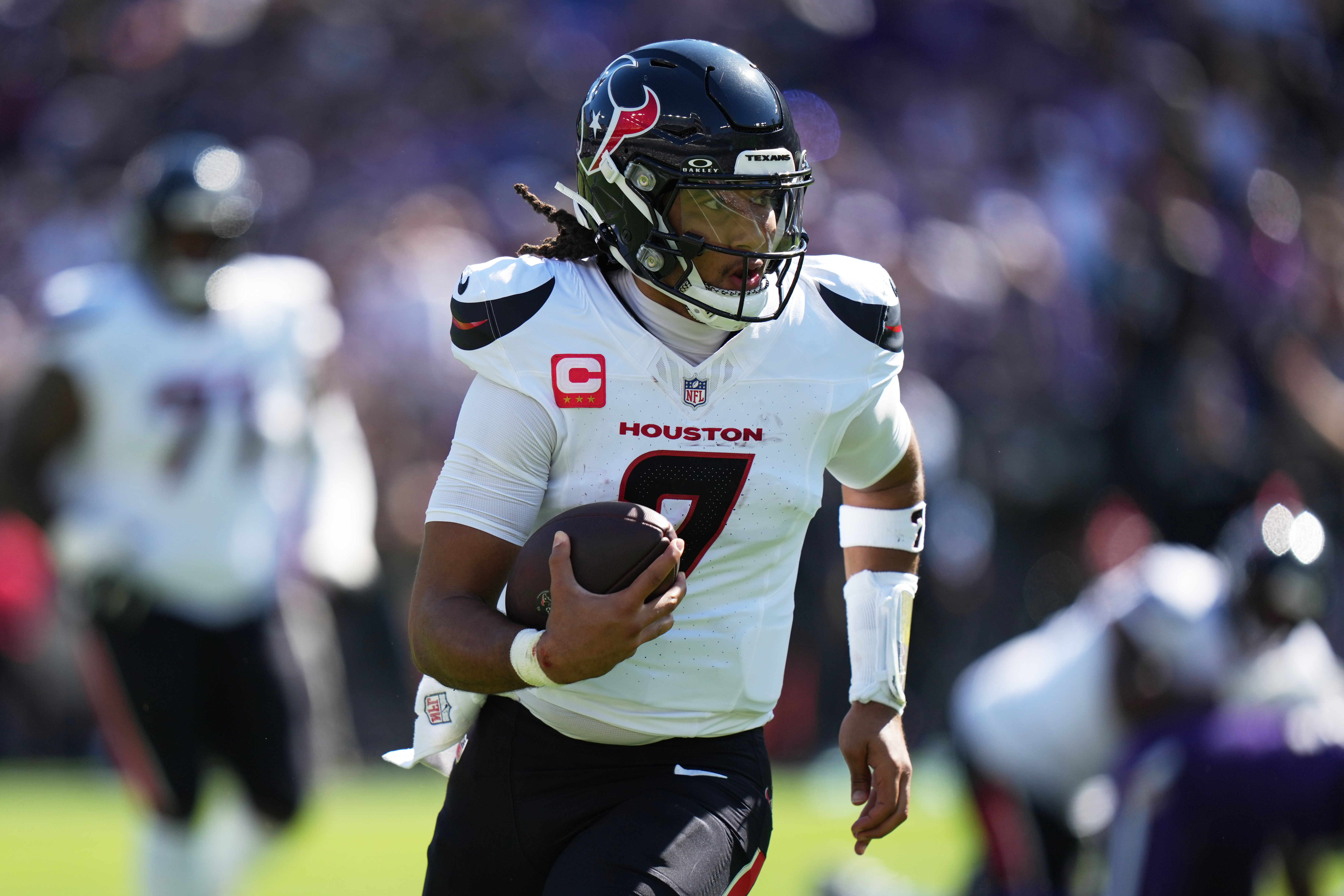 Houston Texans quarterback C.J. Stroud (7) runs the ball during the first half of an NFL football game against the Baltimore Ravens, Sunday, Oct. 5, 2025, in Baltimore.