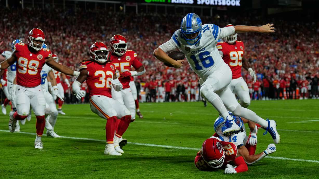 Detroit Lions quarterback Jared Goff (16) runs into the end zone over Kansas City Chiefs cornerback Trent McDuffie (22) on a play that was nullified after Goff was called for illegal motioin on the play during the first half of an NFL football game Sunday, Oct. 12, 2025, in Kansas City, Mo.