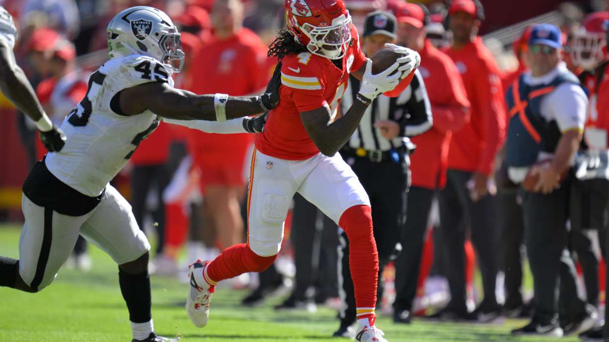 Kansas City Chiefs wide receiver Rashee Rice (4) is pushed out of bounds by Las Vegas Raiders linebacker Devin White (45) during the first half of an NFL football game Sunday, Oct. 19, 2025, in Kansas City, Mo.