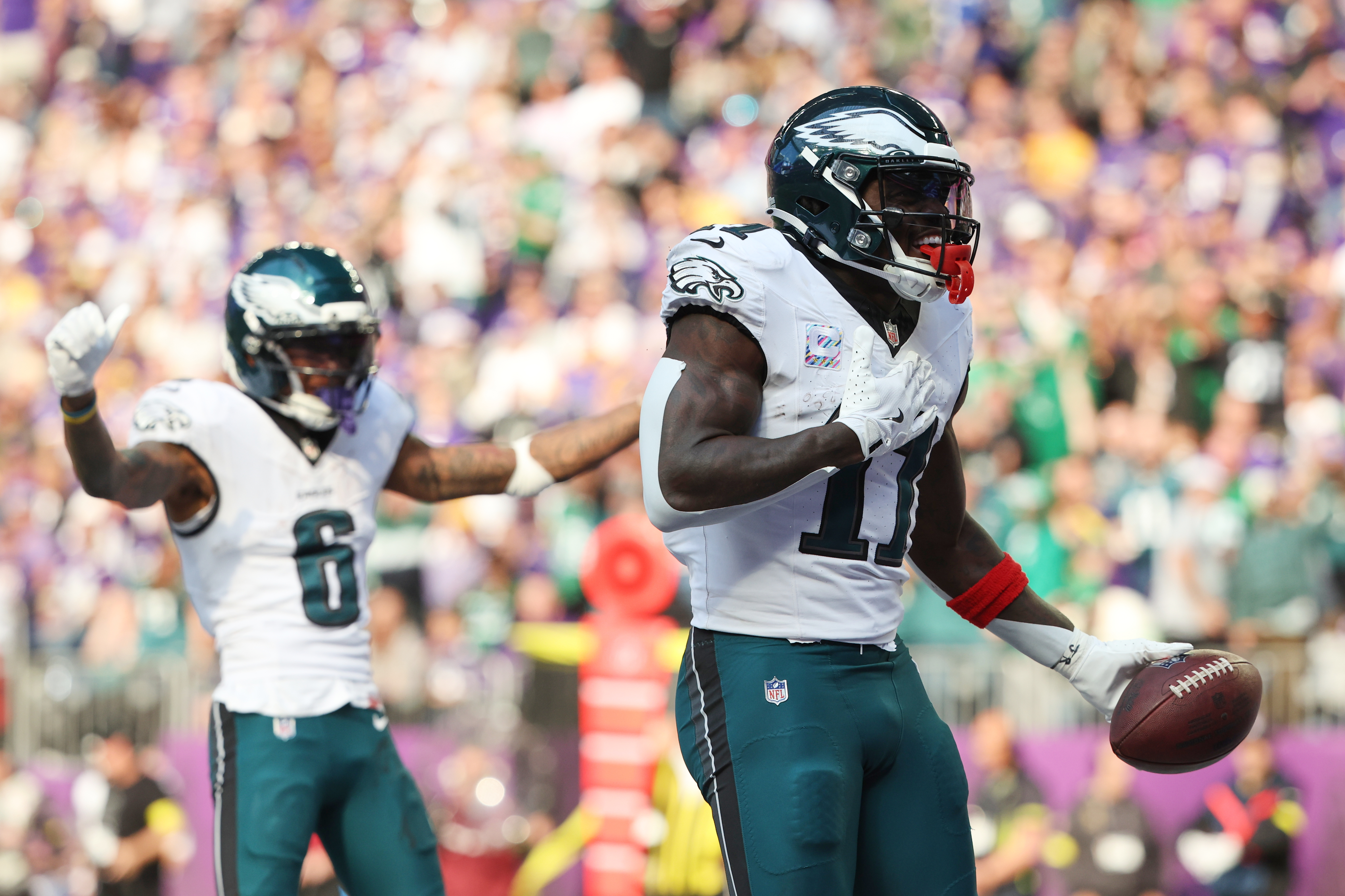 Philadelphia Eagles wide receiver A.J. Brown (11) celebrates his touchdown catch during the second half of an NFL football game against the Minnesota Vikings, Sunday, Oct. 19, 2025, in Minneapolis. 