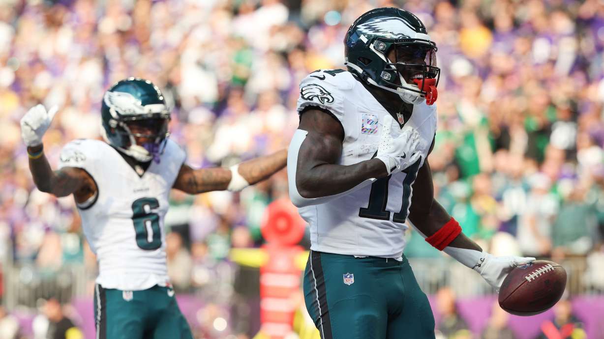 Philadelphia Eagles wide receiver A.J. Brown (11) celebrates his touchdown catch during the second half of an NFL football game against the Minnesota Vikings, Sunday, Oct. 19, 2025, in Minneapolis.