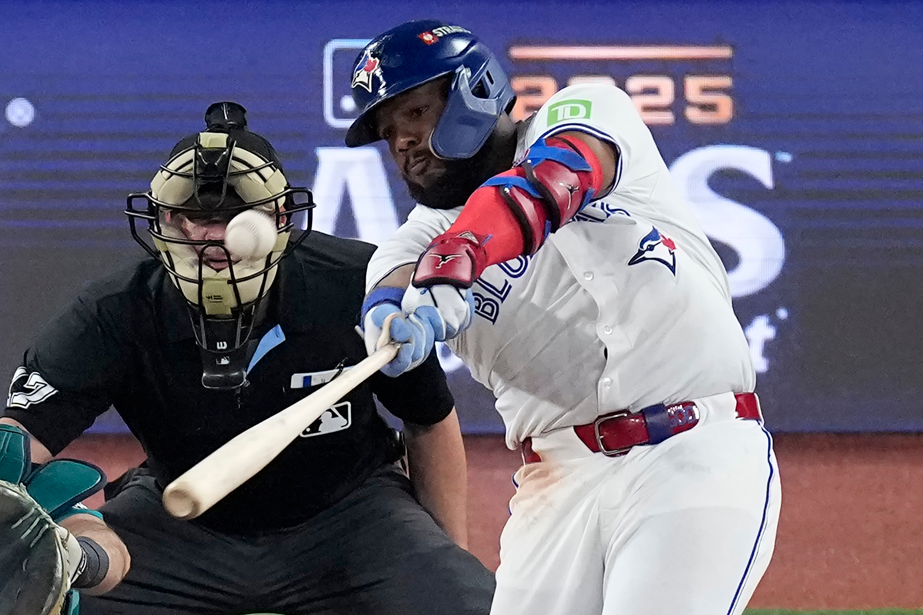 Toronto Blue Jays' Vladimir Guerrero Jr. connects for a solo home run against the Seattle Mariners during the fifth inning in Game 6 of baseball's American League Championship Series, Sunday, Oct. 19, 2025, in Toronto. 
