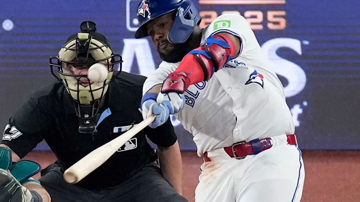 Toronto Blue Jays' Vladimir Guerrero Jr. connects for a solo home run against the Seattle Mariners during the fifth inning in Game 6 of baseball's American League Championship Series, Sunday, Oct. 19, 2025, in Toronto.