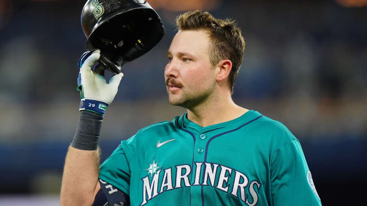 Seattle Mariners' Cal Raleigh reacts after grounding into a double play during the third inning of Game 6 of baseball's American League Championship Series against the Toronto Blue Jays in Toronto, Sunday, Oct. 19, 2025.