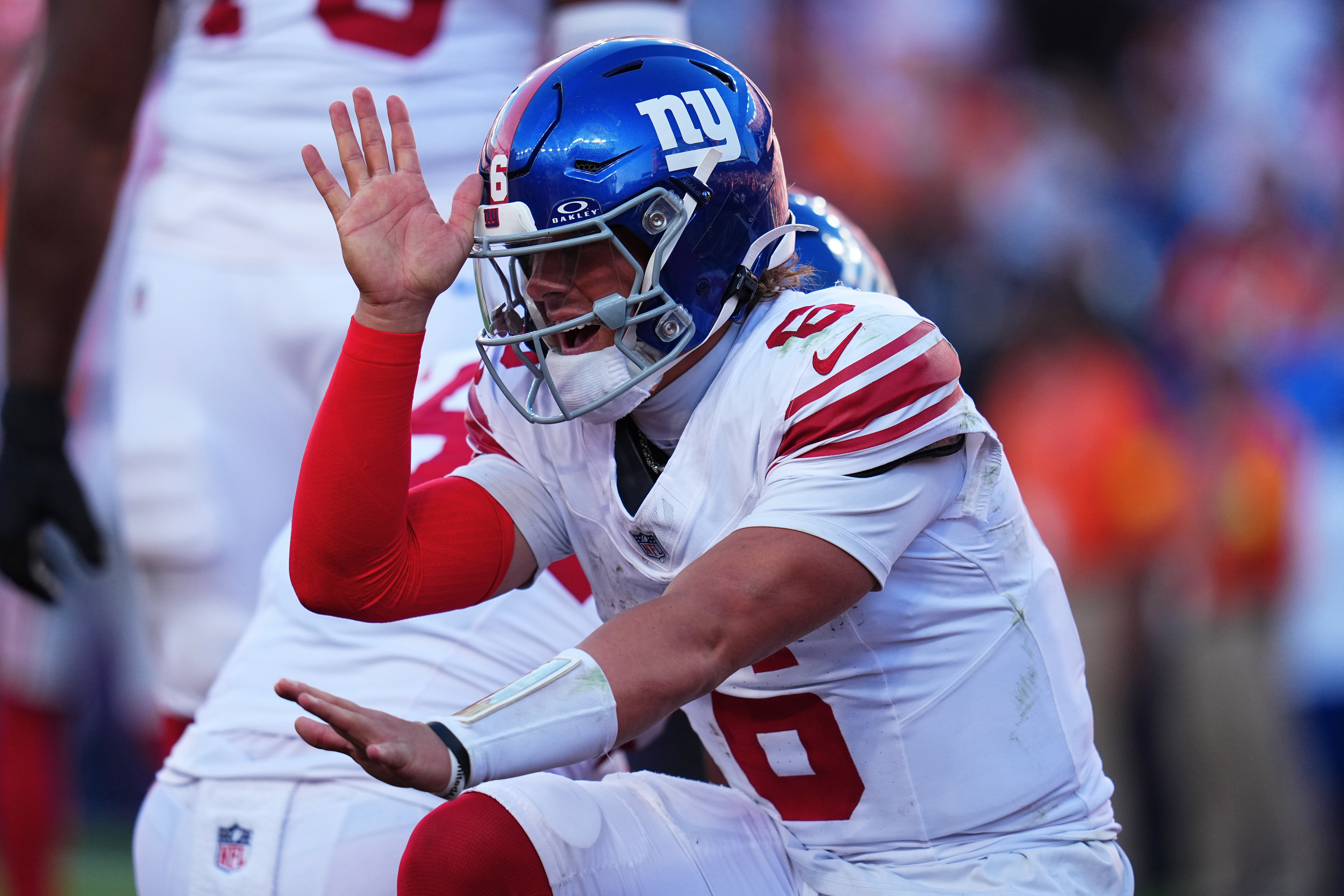 New York Giants quarterback Jaxson Dart (6) celebrates after tight end Theo Johnson scored against the Denver Broncos during the second half of an NFL football game in Denver, Sunday, Oct. 19, 2025.