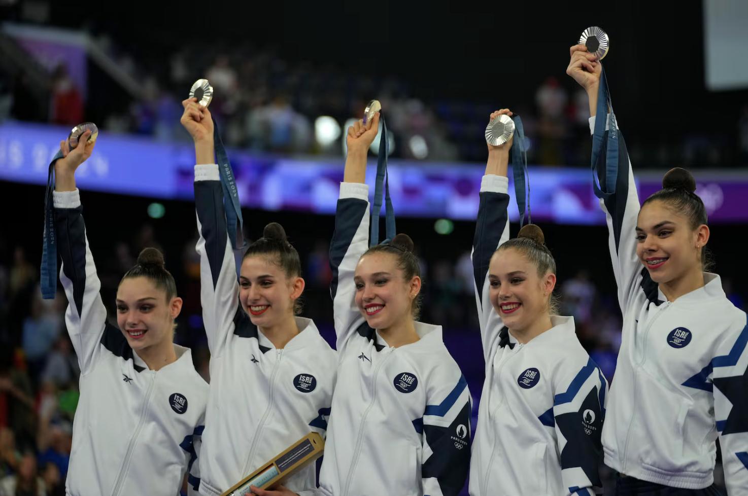 Team Israel poses for a photograph after winning the silver medal in the group all-around rhythmic gymnastics at La Chapelle Arena during the 2024 Summer Olympics, Aug. 10, 2024, in Paris.