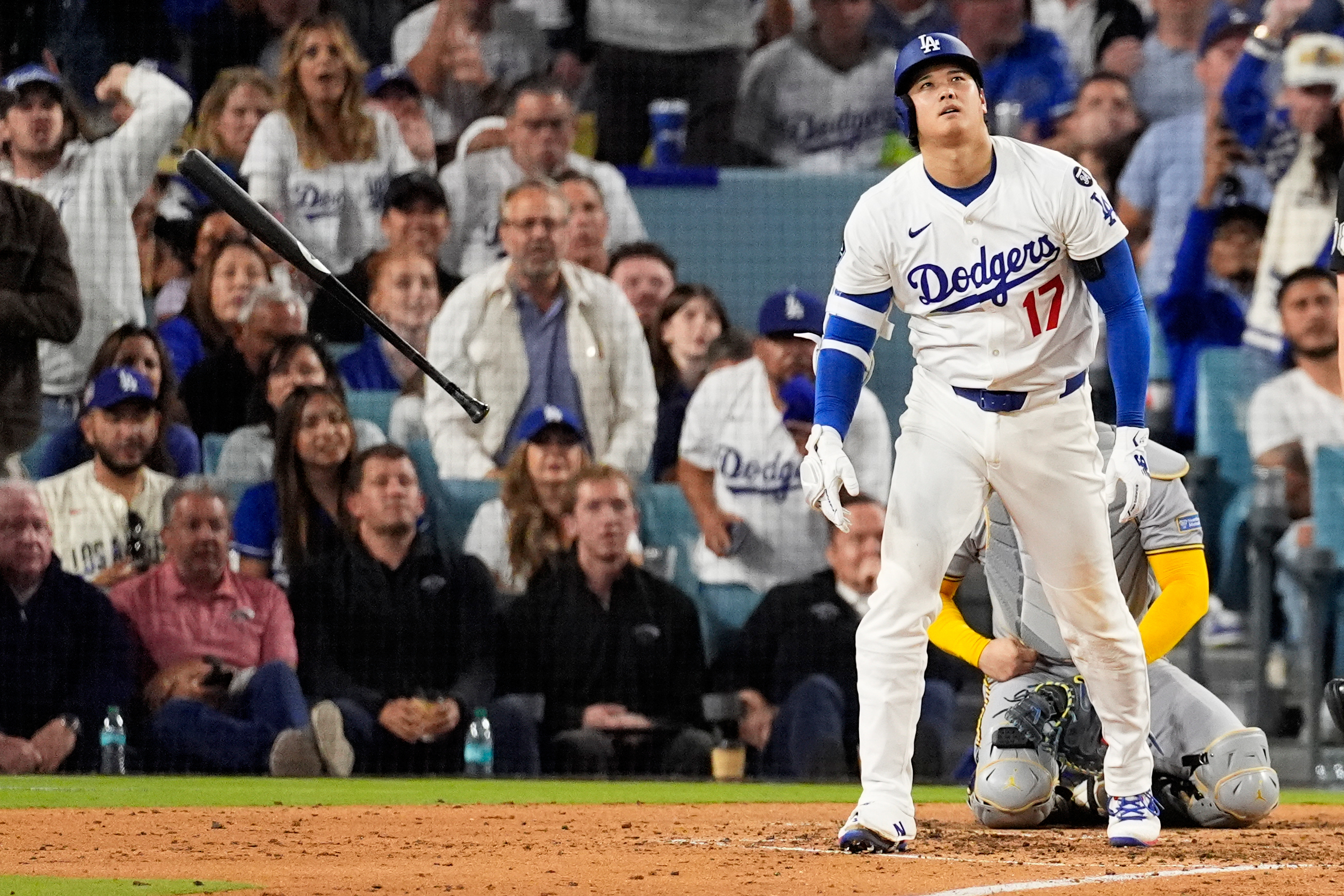 Los Angeles Dodgers' Shohei Ohtani watches his home run against the Milwaukee Brewers during the fourth inning in Game 4 of baseball's National League Championship Series, Friday, Oct. 17, 2025, in Los Angeles. 