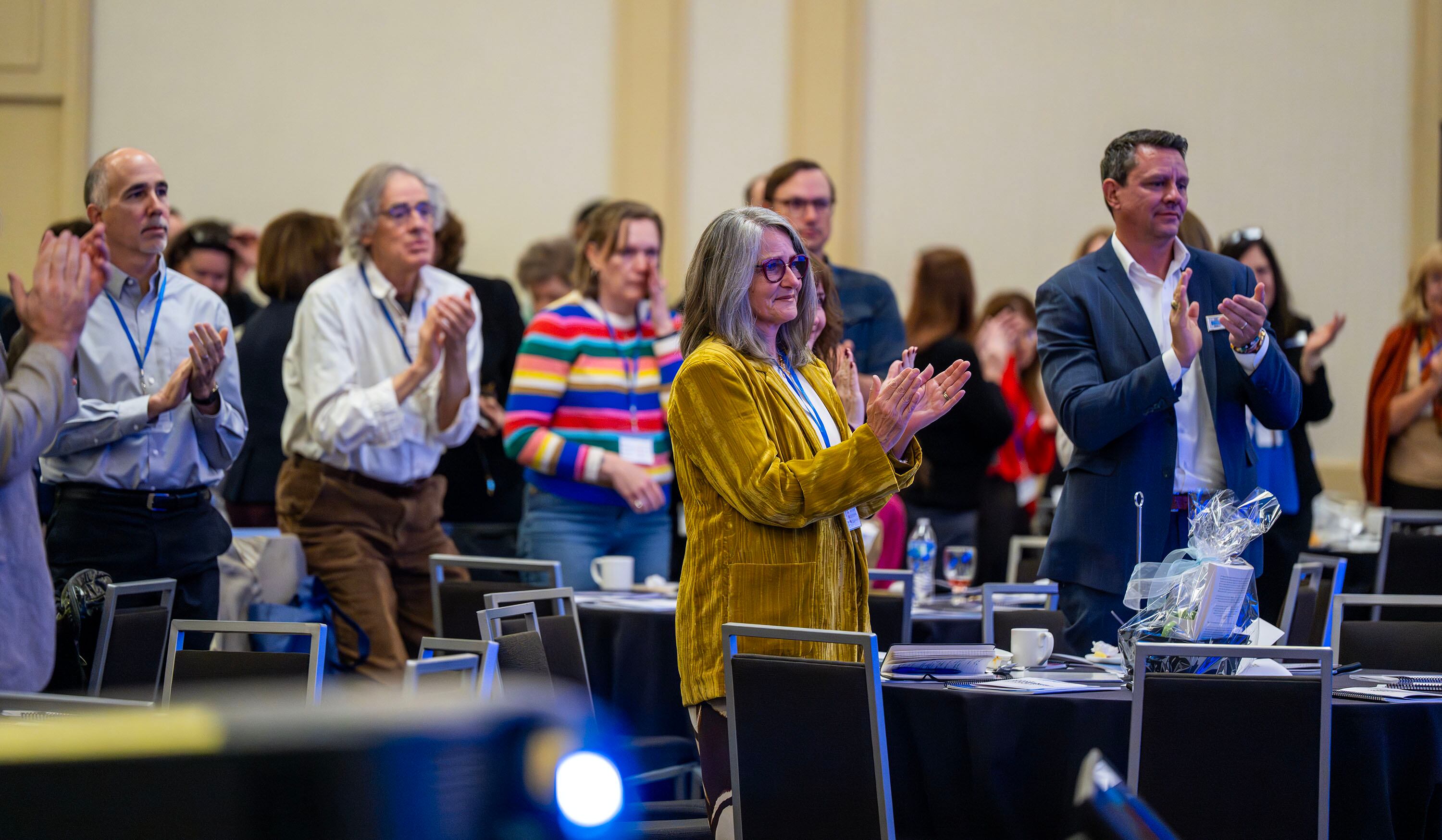 Audience members stand and applaud after listening to Donna Hicks, an international conflict resolution specialist, an associate at the Weatherhead Center for International Affairs at Harvard University and author of "Leading with Dignity," who spoke at the Dignity Index Summit at the Salt Lake Hilton on Monday.