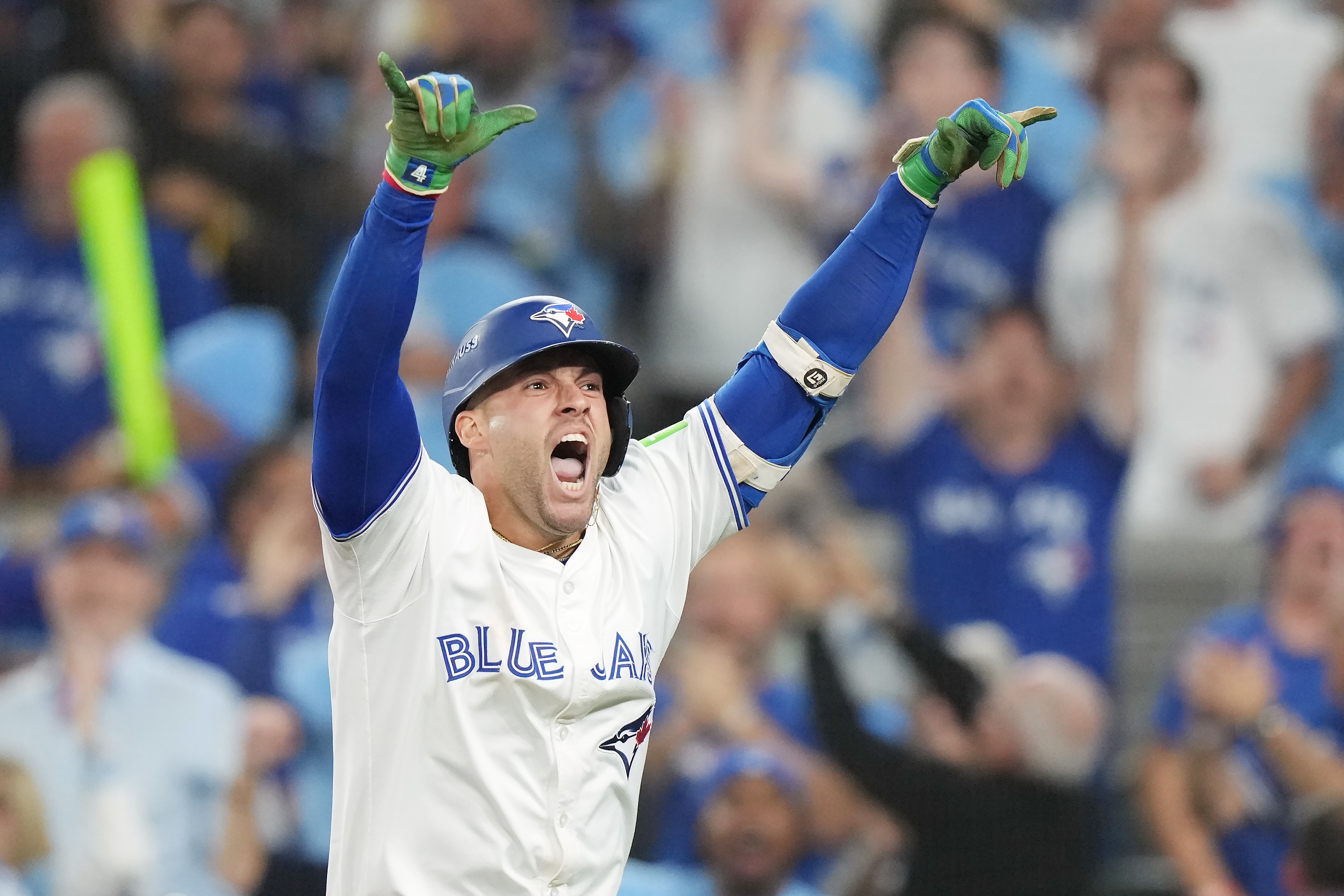 Toronto Blue Jays' George Springer celebrates after hitting a three-run home run against the Seattle Mariners during the seventh inning in Game 7 of baseball's American League Championship Series in Toronto, Monday, Oct. 20, 2025. 